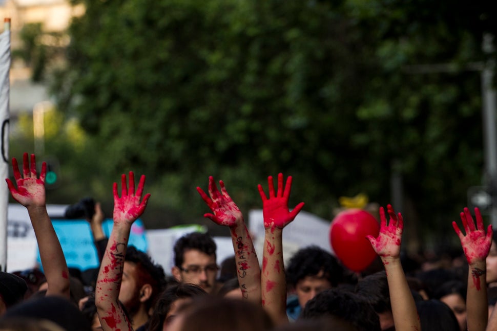 27 Powerful Images Of Women Protesting Against Femicide In Latin