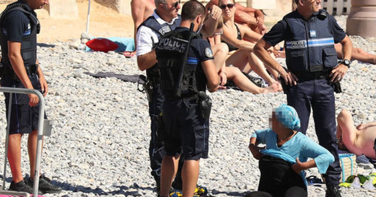 Photos Of Burkini Ban Enforcement  Show Frightening Reality Of Policing Women's Bodies