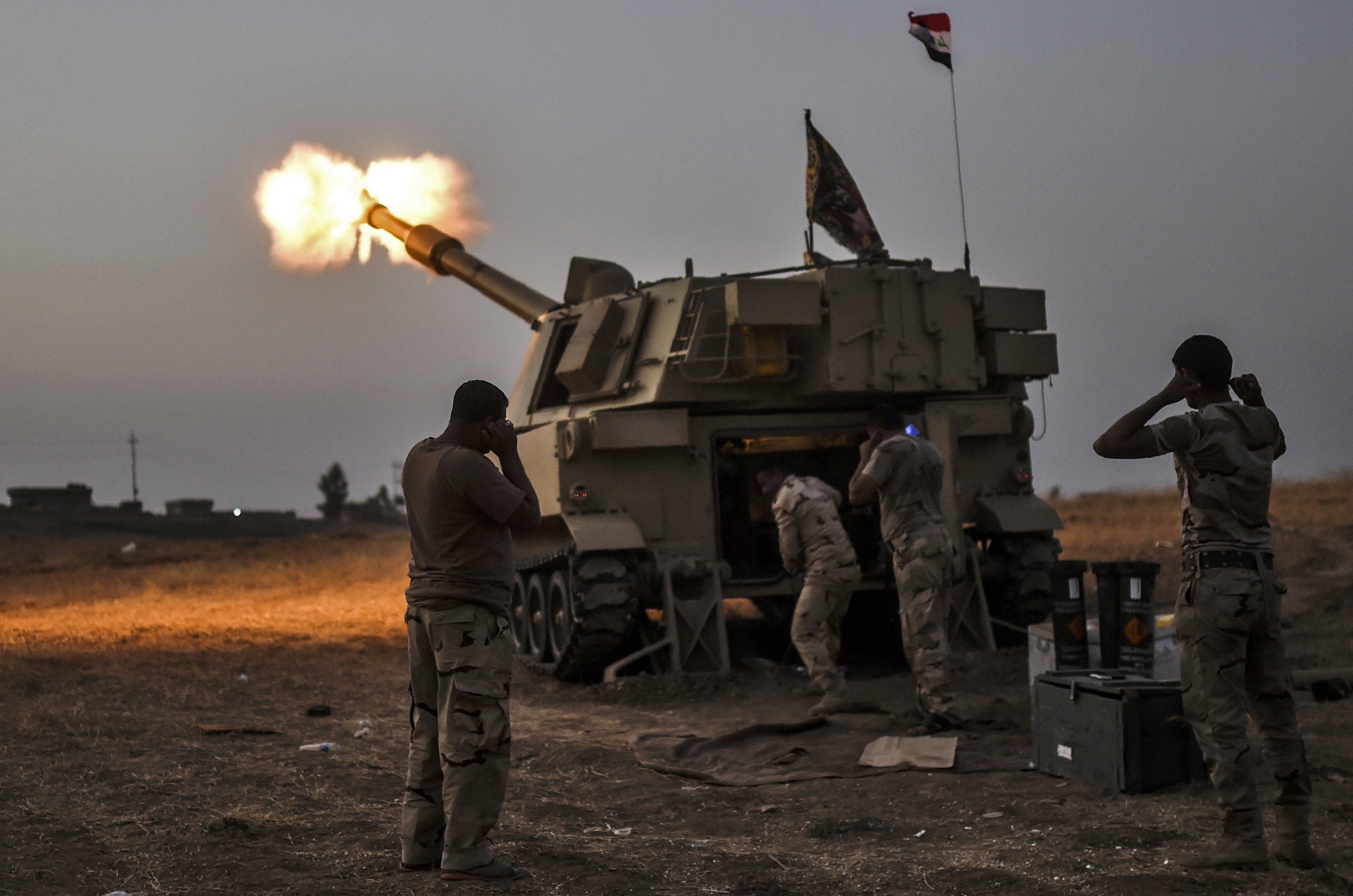 Iraqi forces fire a M109 self-propelled howitzer towards the village of Al-Muftuya from a position in Kani al-Harami, some 21 miles from Mosul.