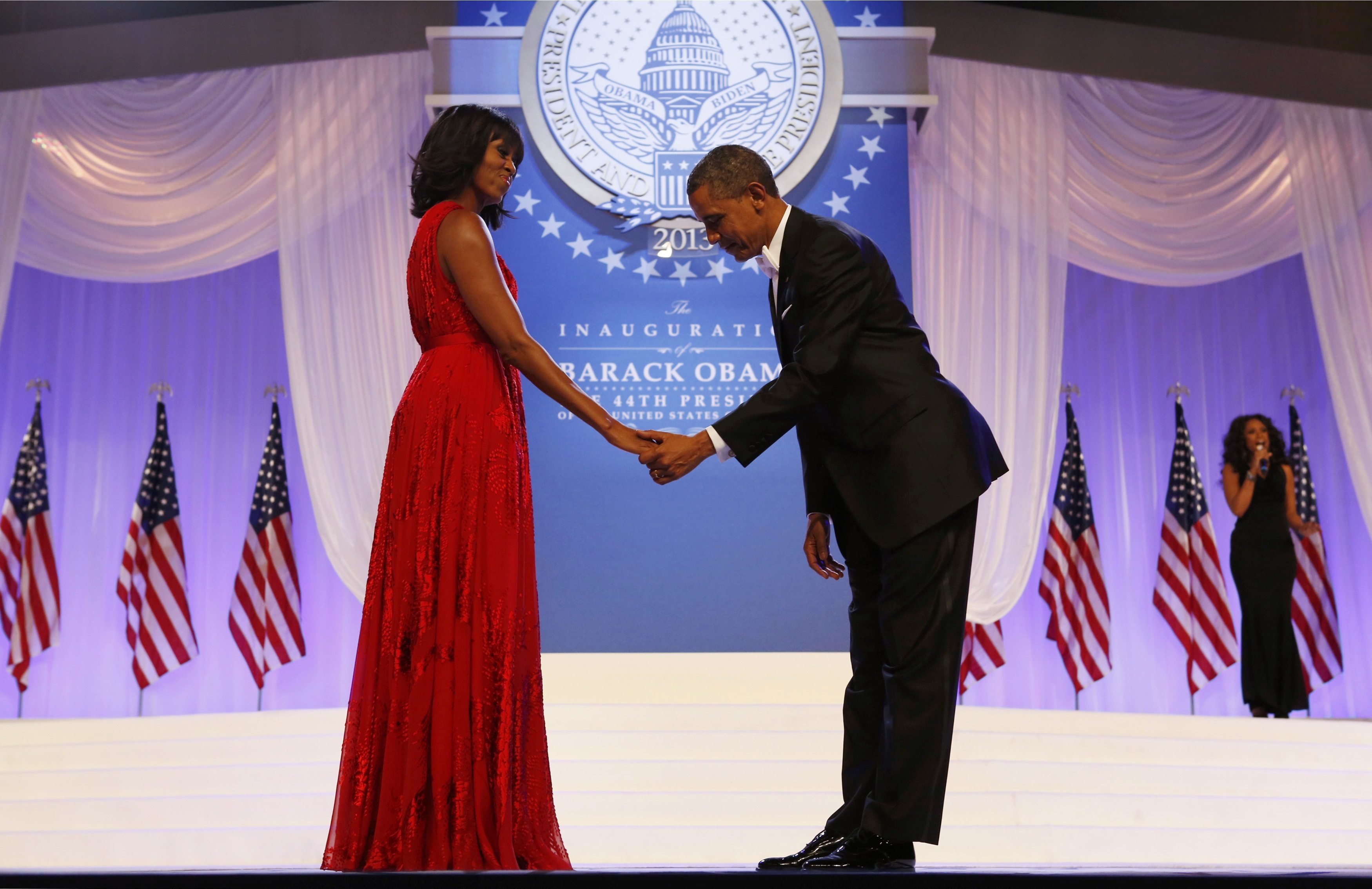 President Barack Obama bows to first lady Michelle Obama at the Inaugural Ball in Washington on Jan. 21, 2013.