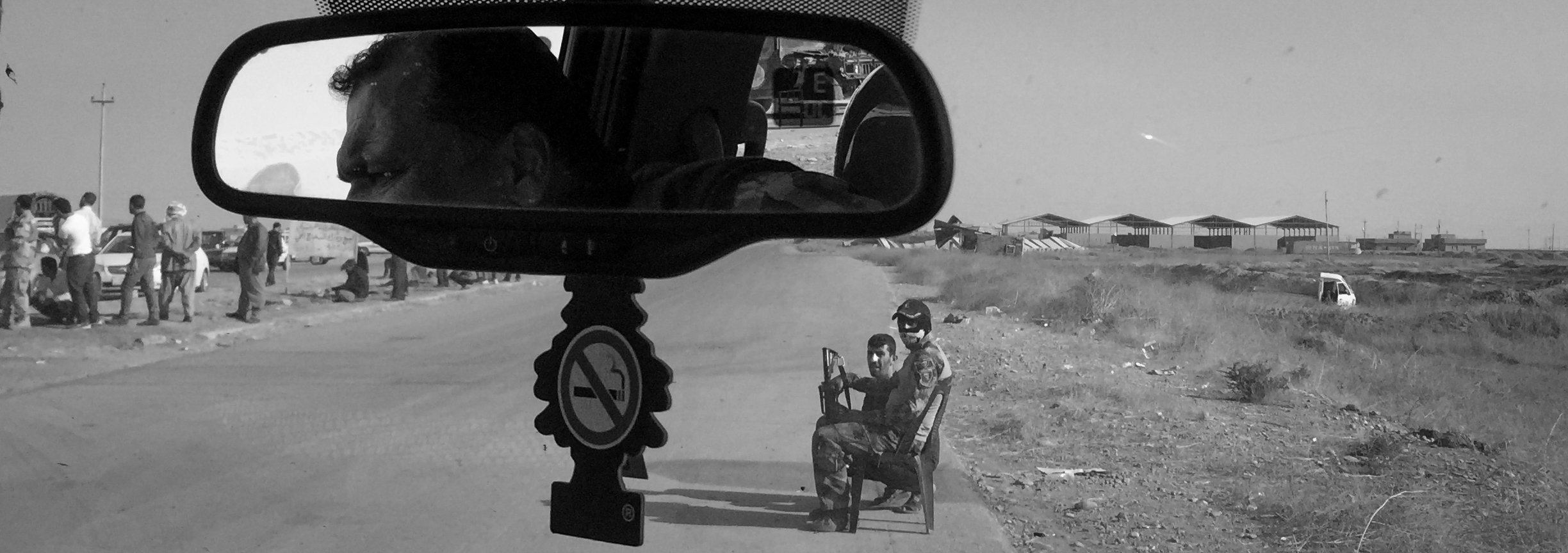 Soldiers are seen at a checkpoint on a road leading to Mosul on Nov. 7, 2016, in Bartella, Iraq.