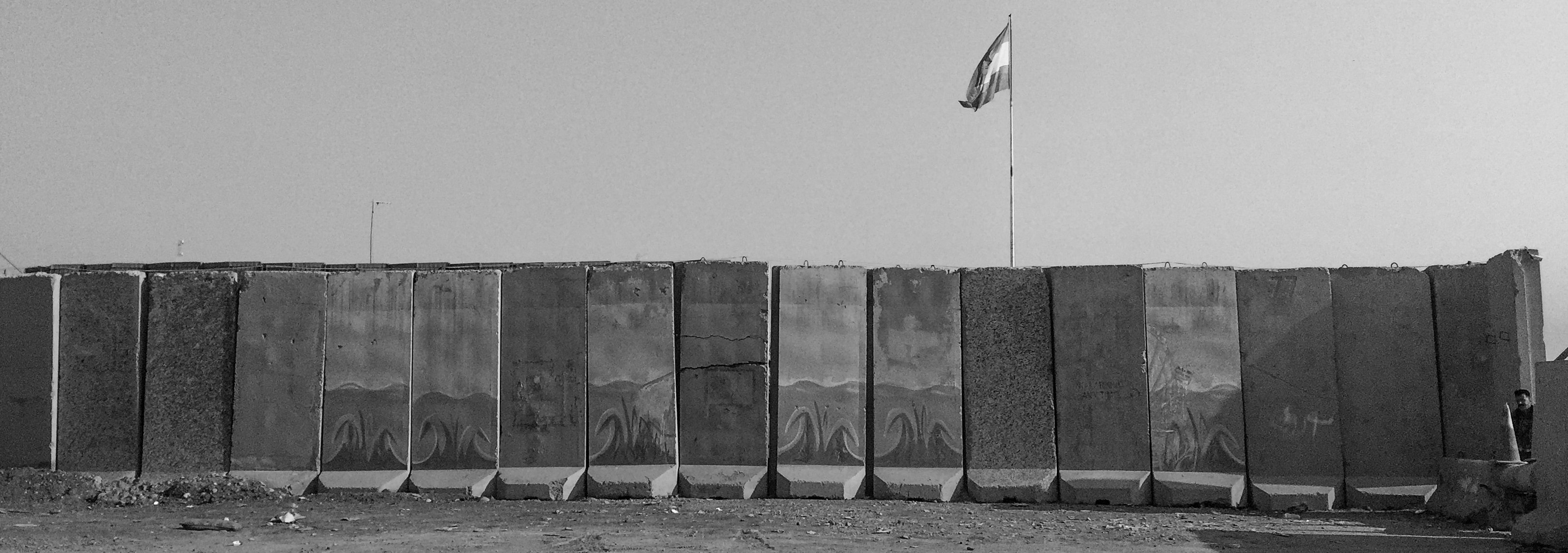 Blast walls protect a Peshmerga checkpoint on a road leading to Mosul on Nov.&nbsp;7, 2016, in Bartella, Iraq.