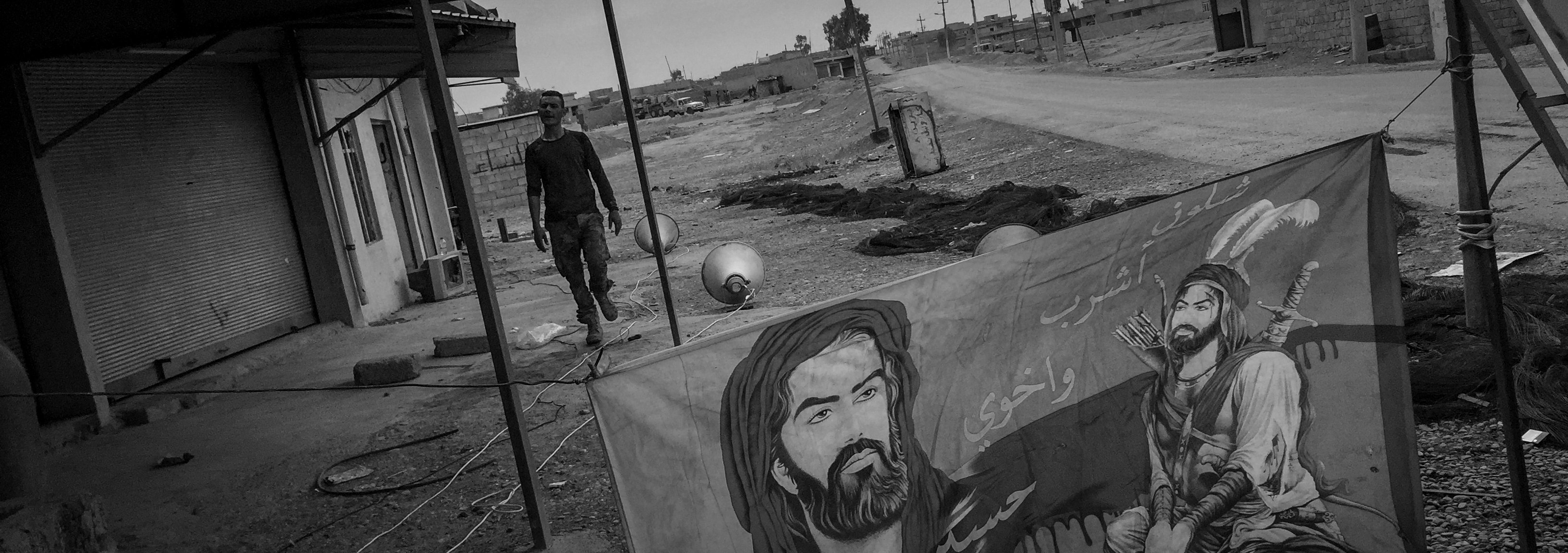 A man is seen walking on a destroyed street leading to Mosul on November 15, 2016 in Mosul, Iraq.&nbsp;