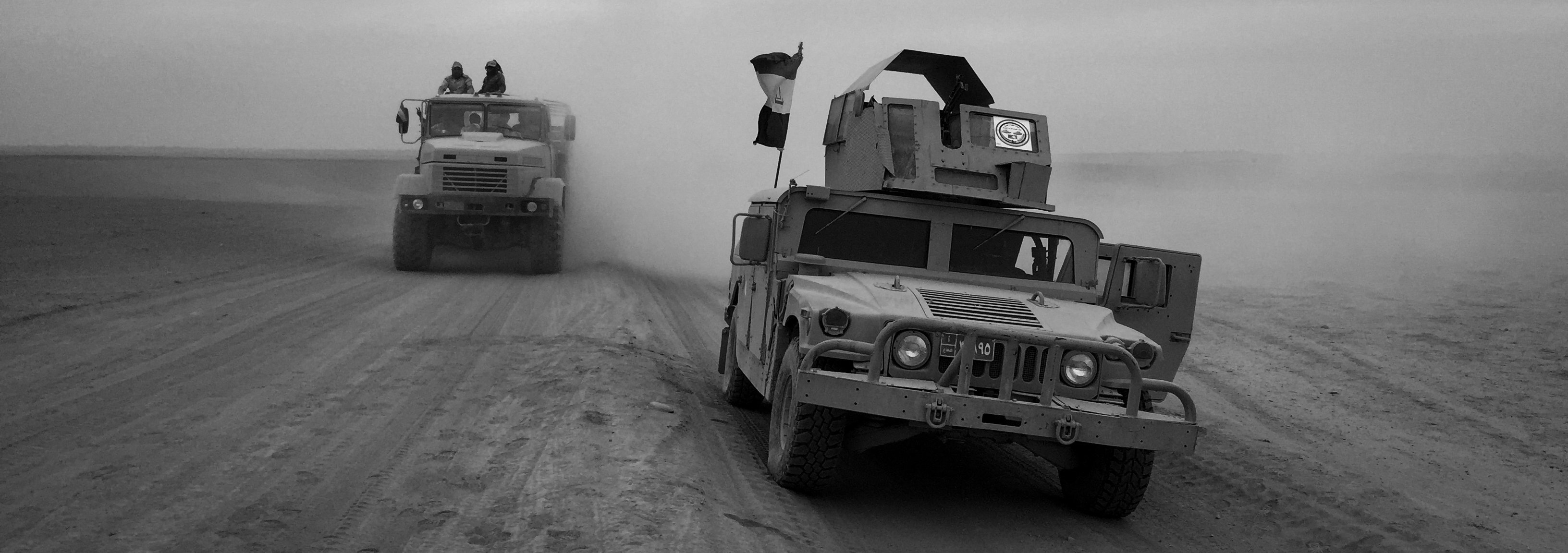 Humvees from the Iraqi Army Armoured Ninth Division are seen on a desert road leading to Mosul on November 15, 2016 in Mosul, Iraq.&nbsp;