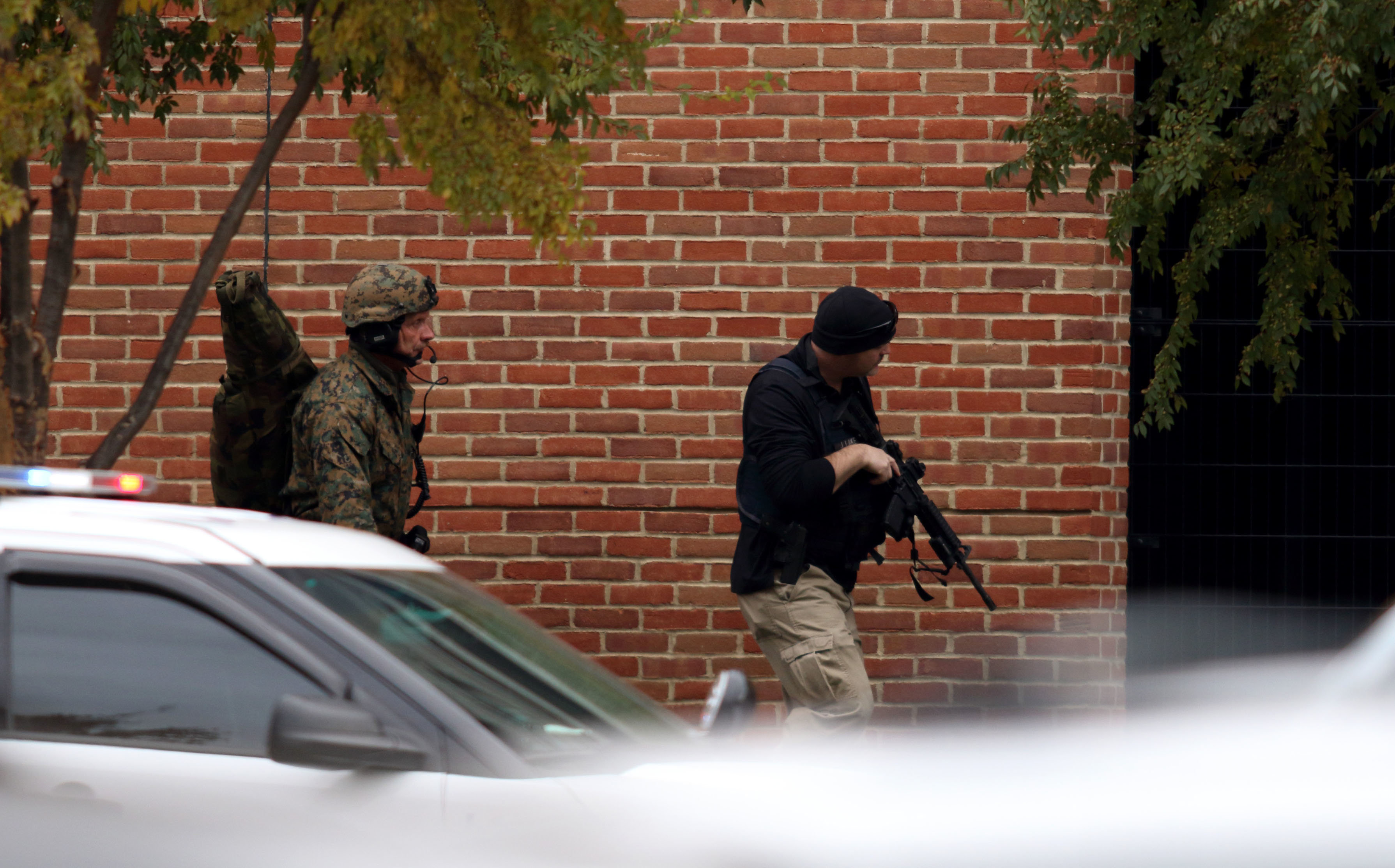 Law enforcement officials are seen outside of a parking garage on the campus of Ohio State University as they respond to an active attack in Columbus, Ohio, on November 28, 2016.&nbsp;