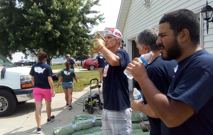 Cyclists gave up their rest day to tear up carpeting for 3 women with MS who share a home in Euclid, OH.