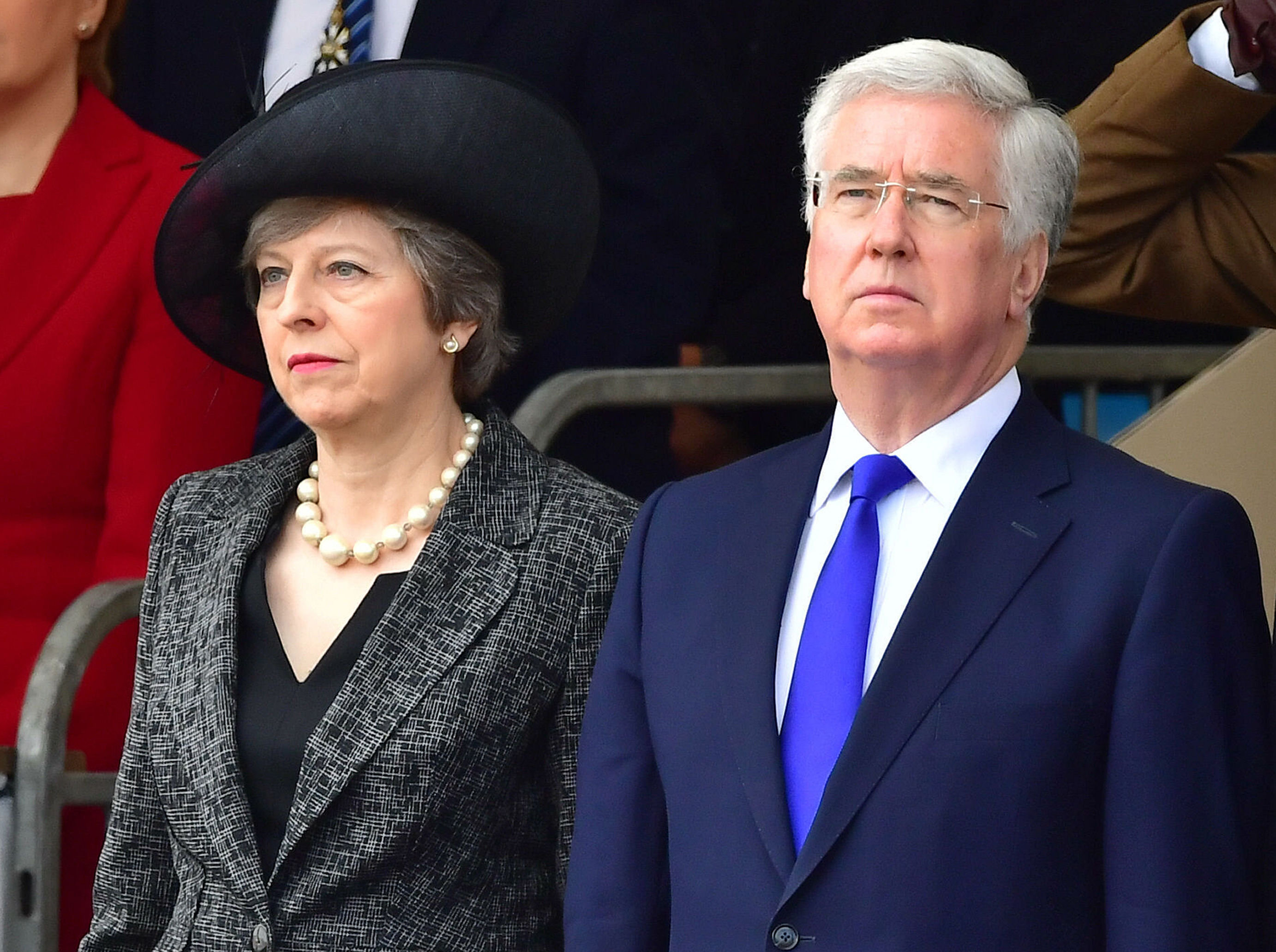 Sir Michael Fallon and Prime Minister Theresa May, who now has to appoint a new Defence Secretary.