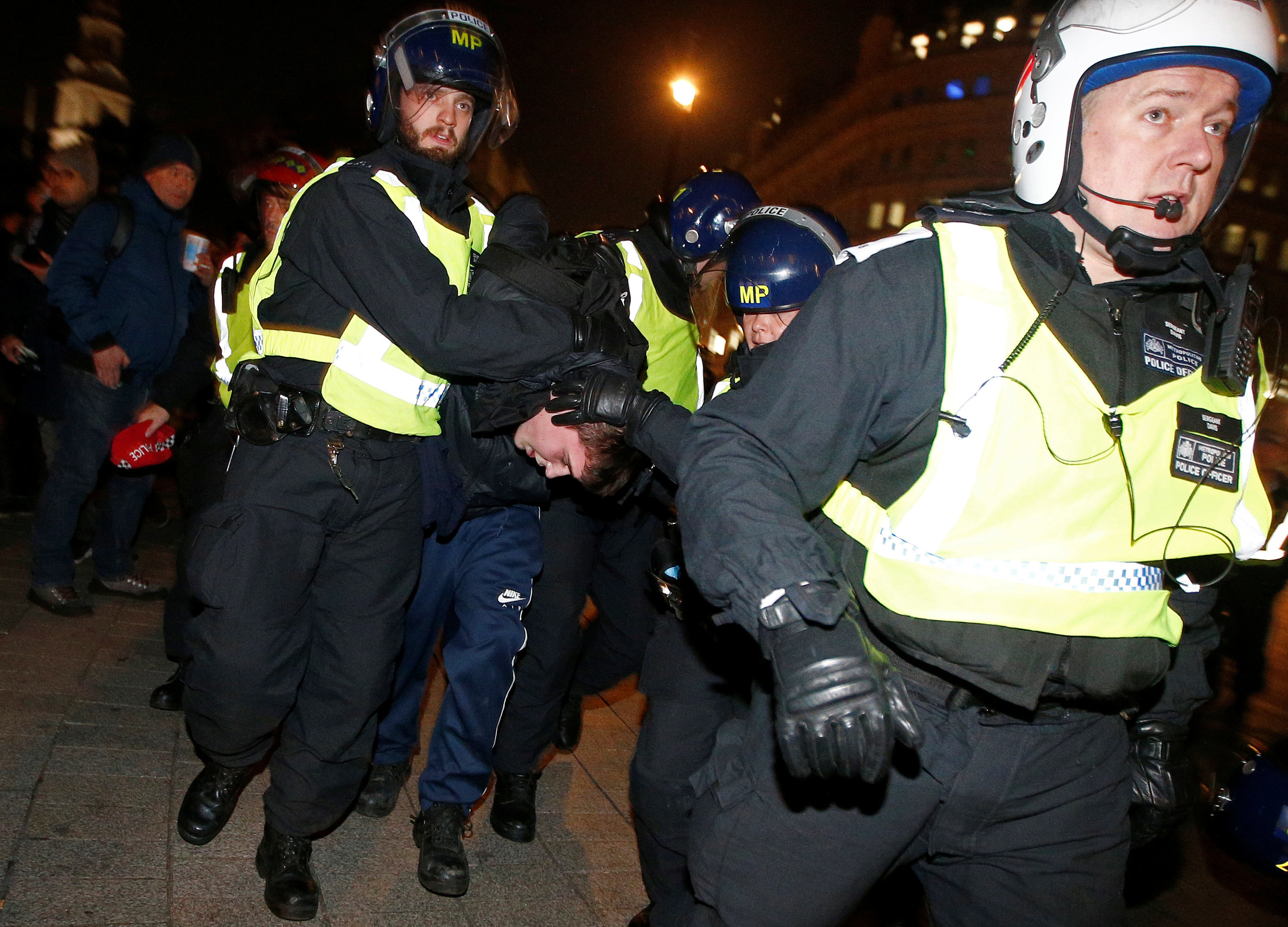 <strong>Police officers apprehend a protester during the march last year&nbsp;</strong>