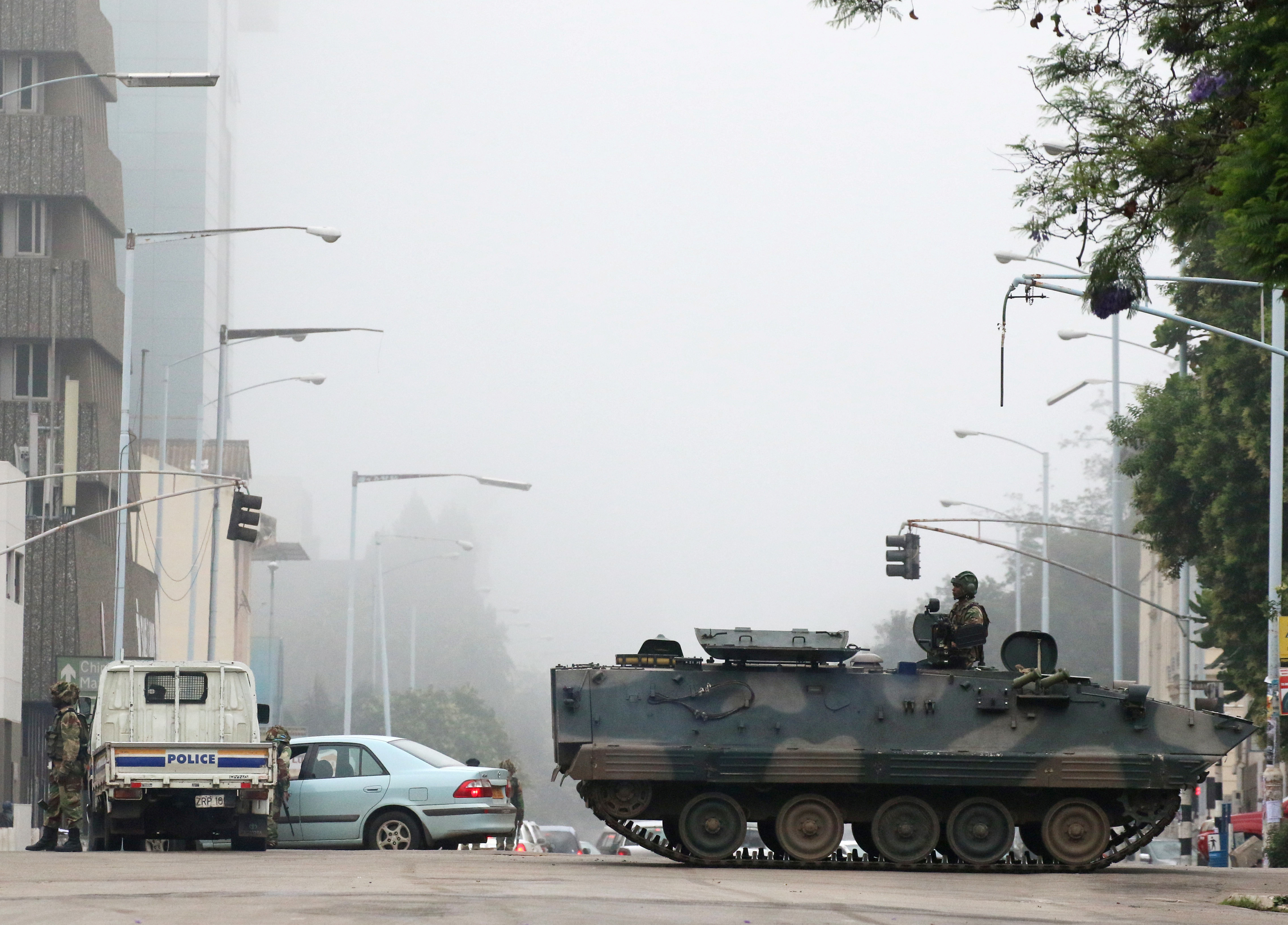 <strong>Military vehicles and soldiers patrol the streets in Harareon Wednesday</strong>