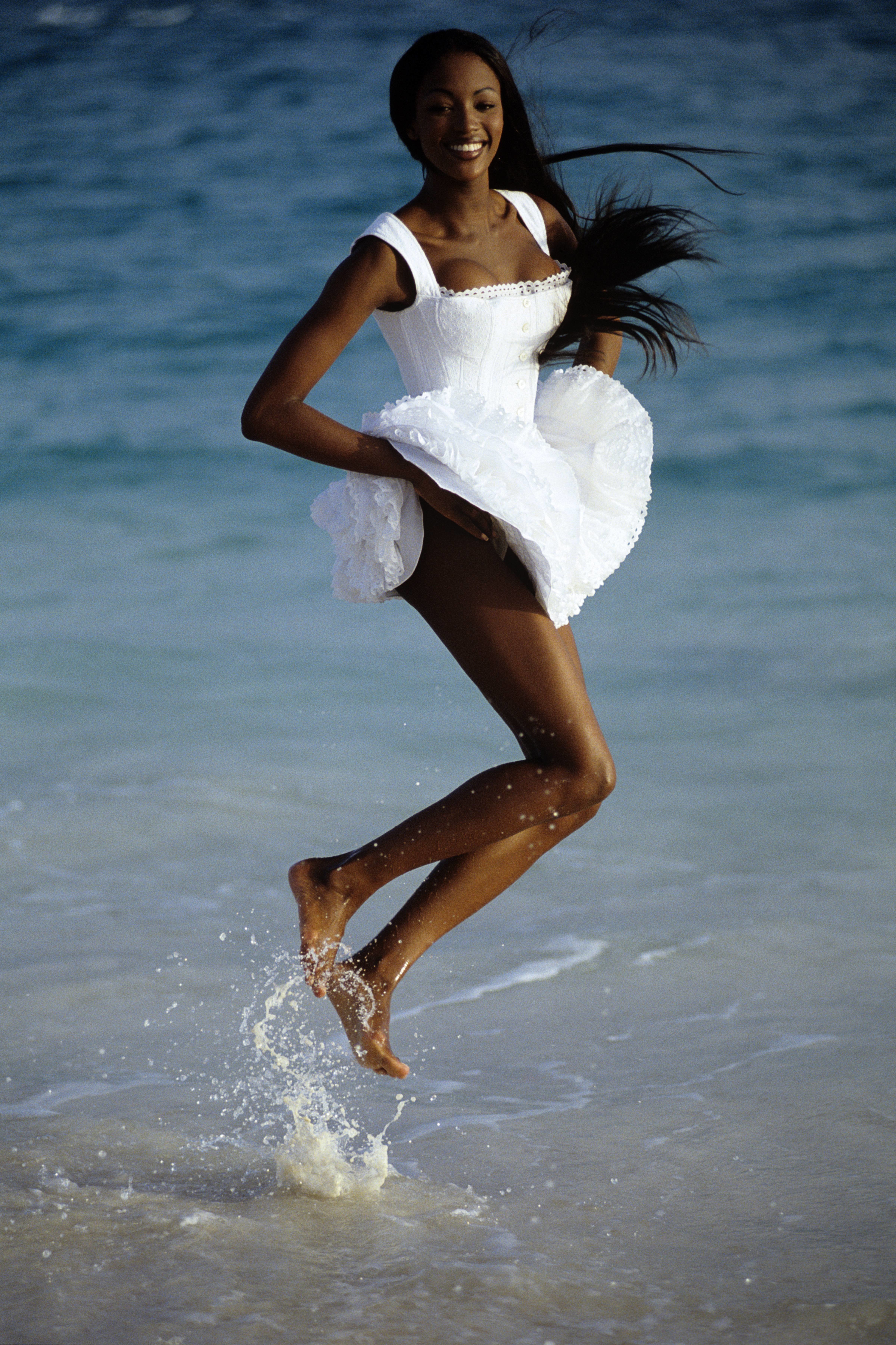 Naomi Campbell wearing a white Azzedine Ala&iuml;a dress.