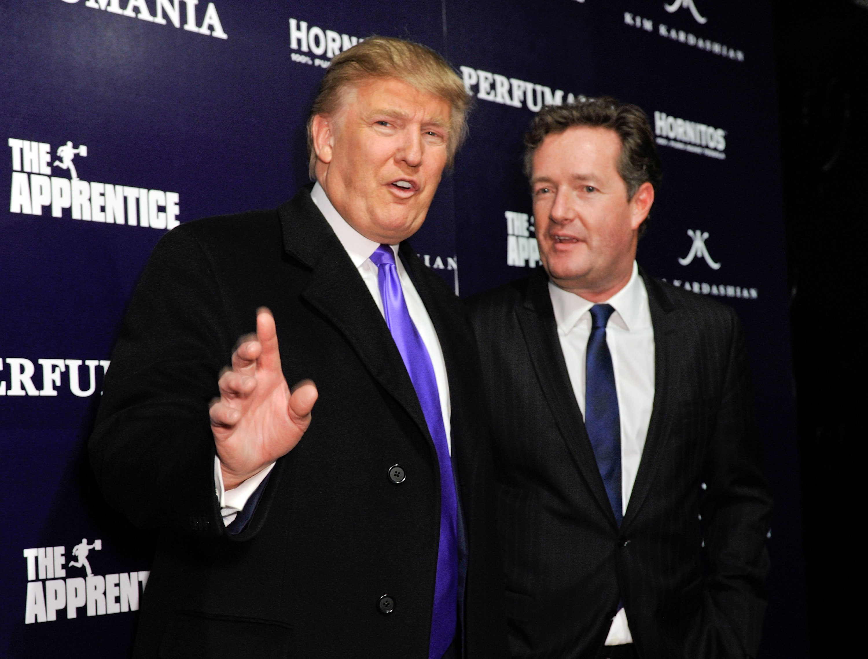 <strong>The President celebrating Perfumania's appearance with Kim Kardashian on 'The Apprentice' in 2010, alongside Piers Morgan</strong>