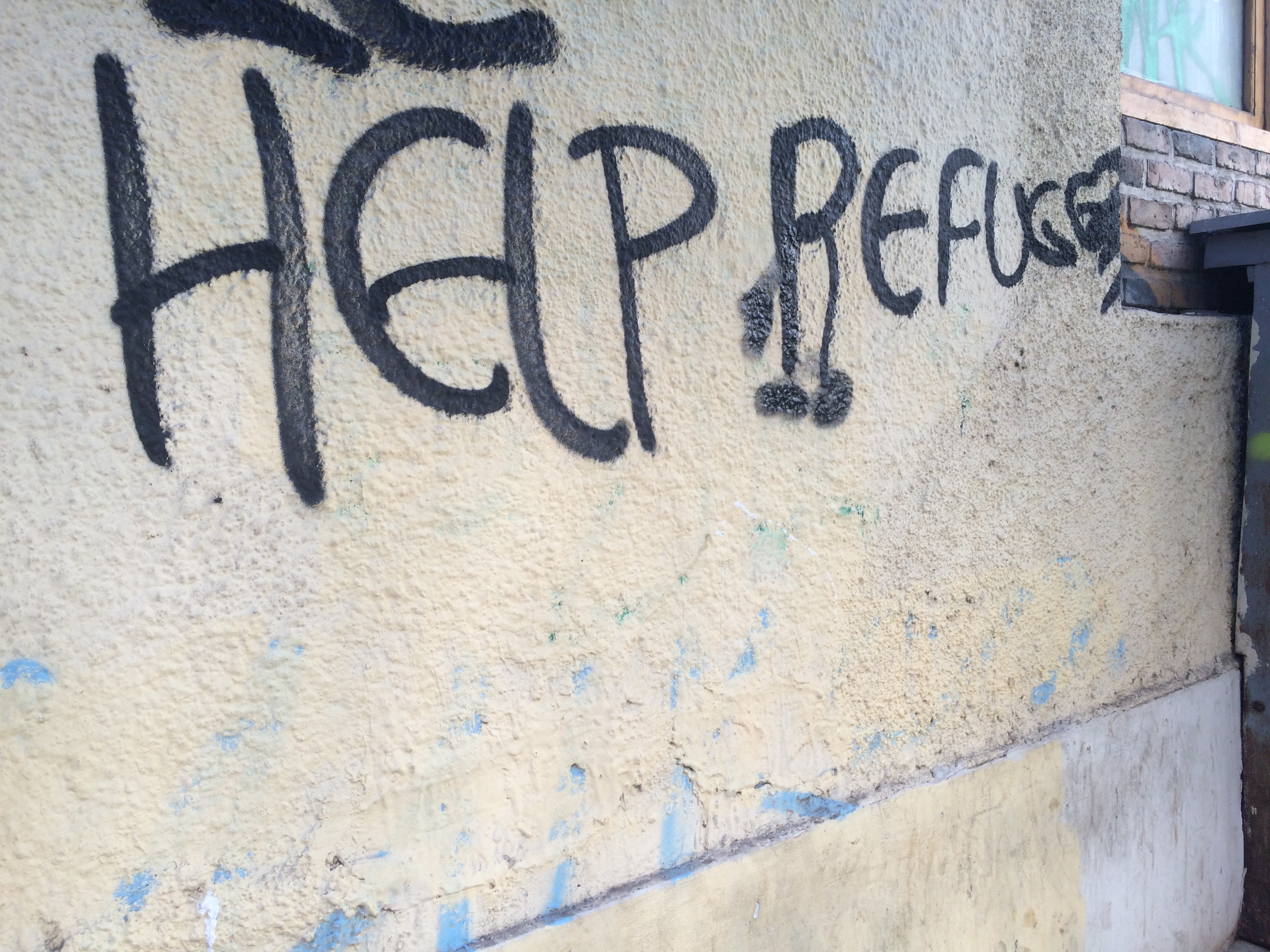 "Help Refugees" graffiti in Athens
