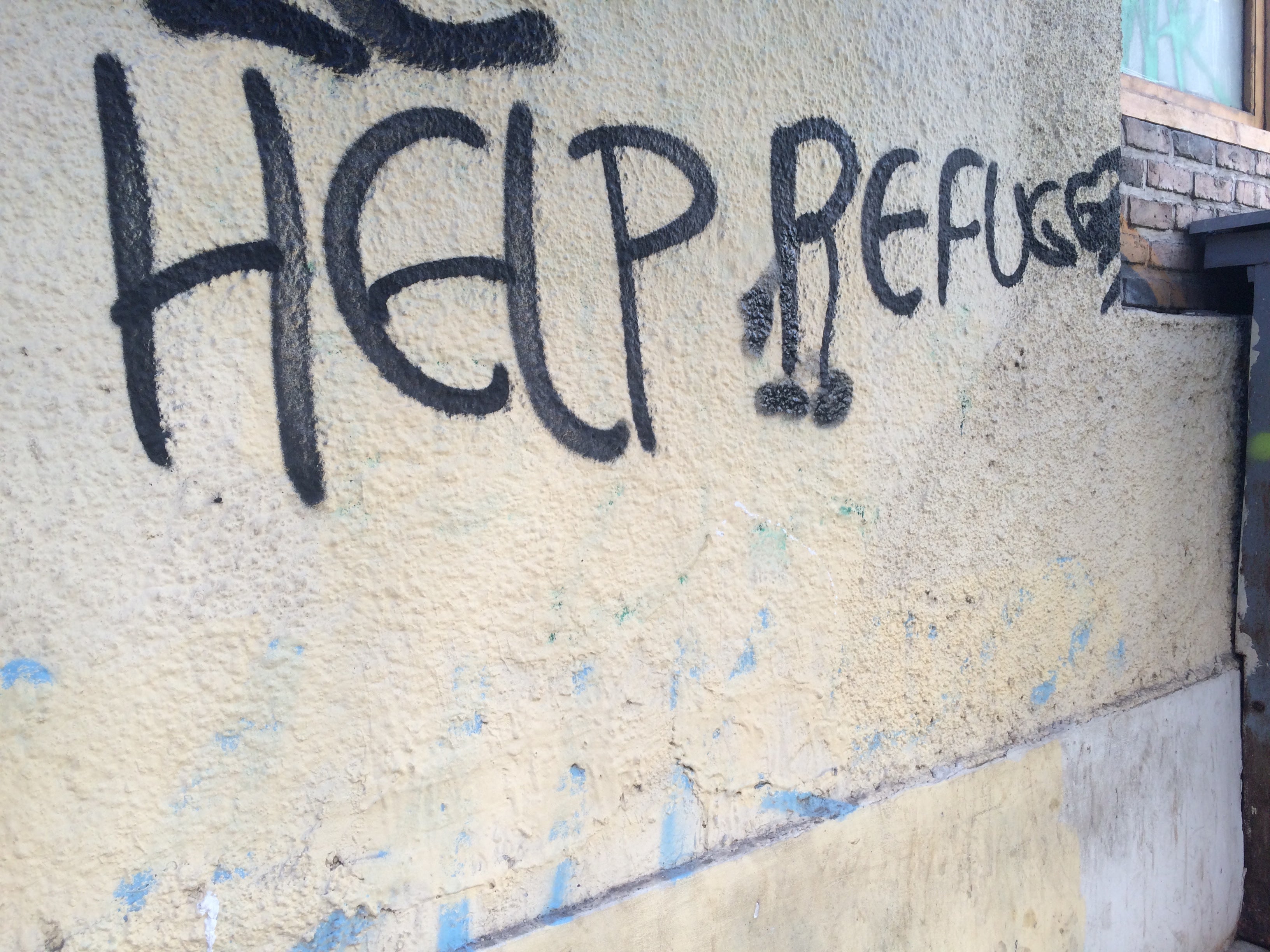 "Help Refugees" graffiti in Athens