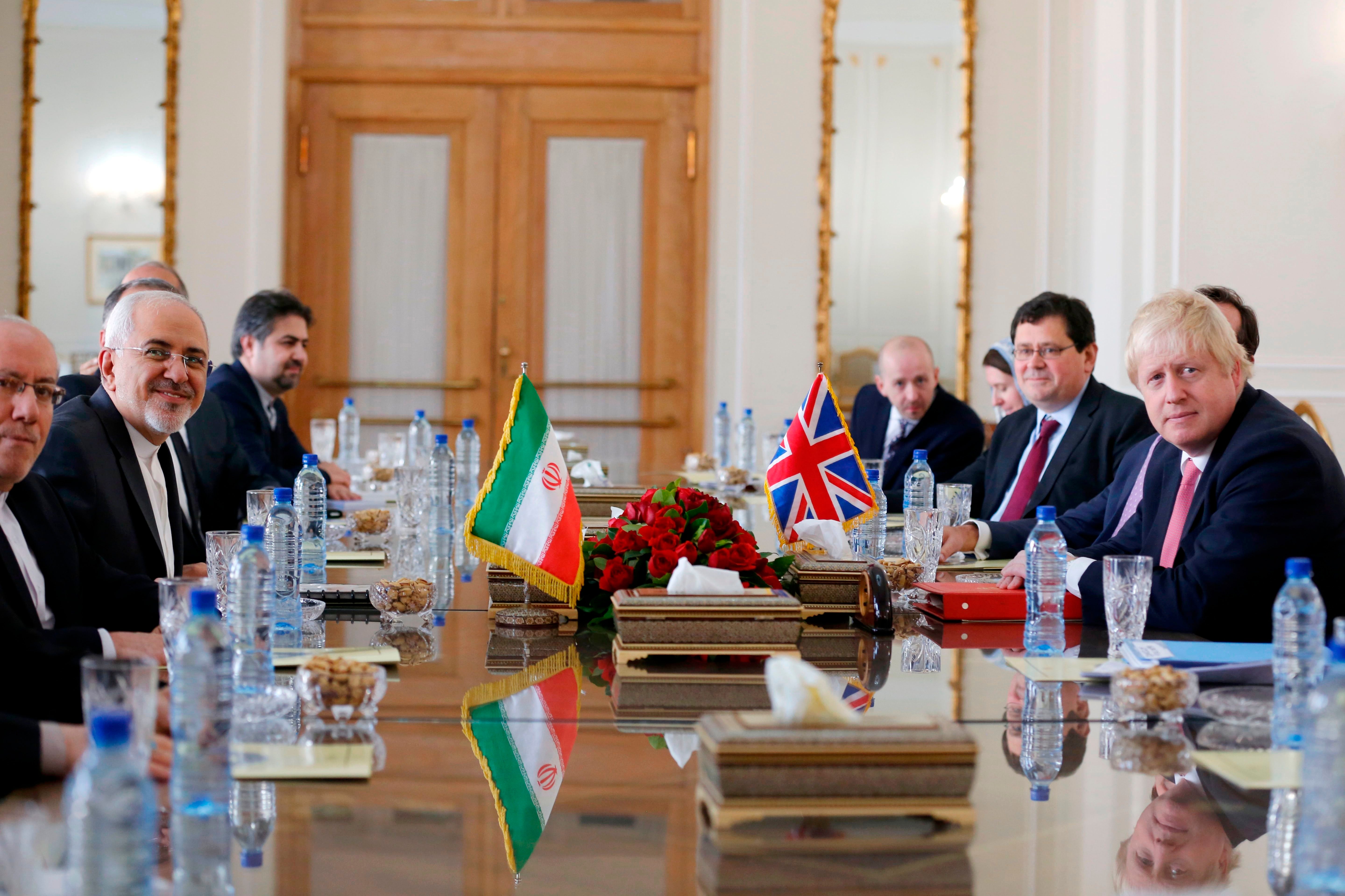 Iran's Foreign Minister&nbsp;Mohammad Javad Zarif (2nd left) meets with Johnson (right) in Tehran on Saturday