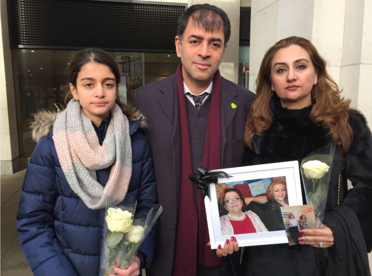 <strong>Shah Aghlani - who lost his mother and aunt in the fire - with his daughter and wife outside the memorial service&nbsp;</strong>