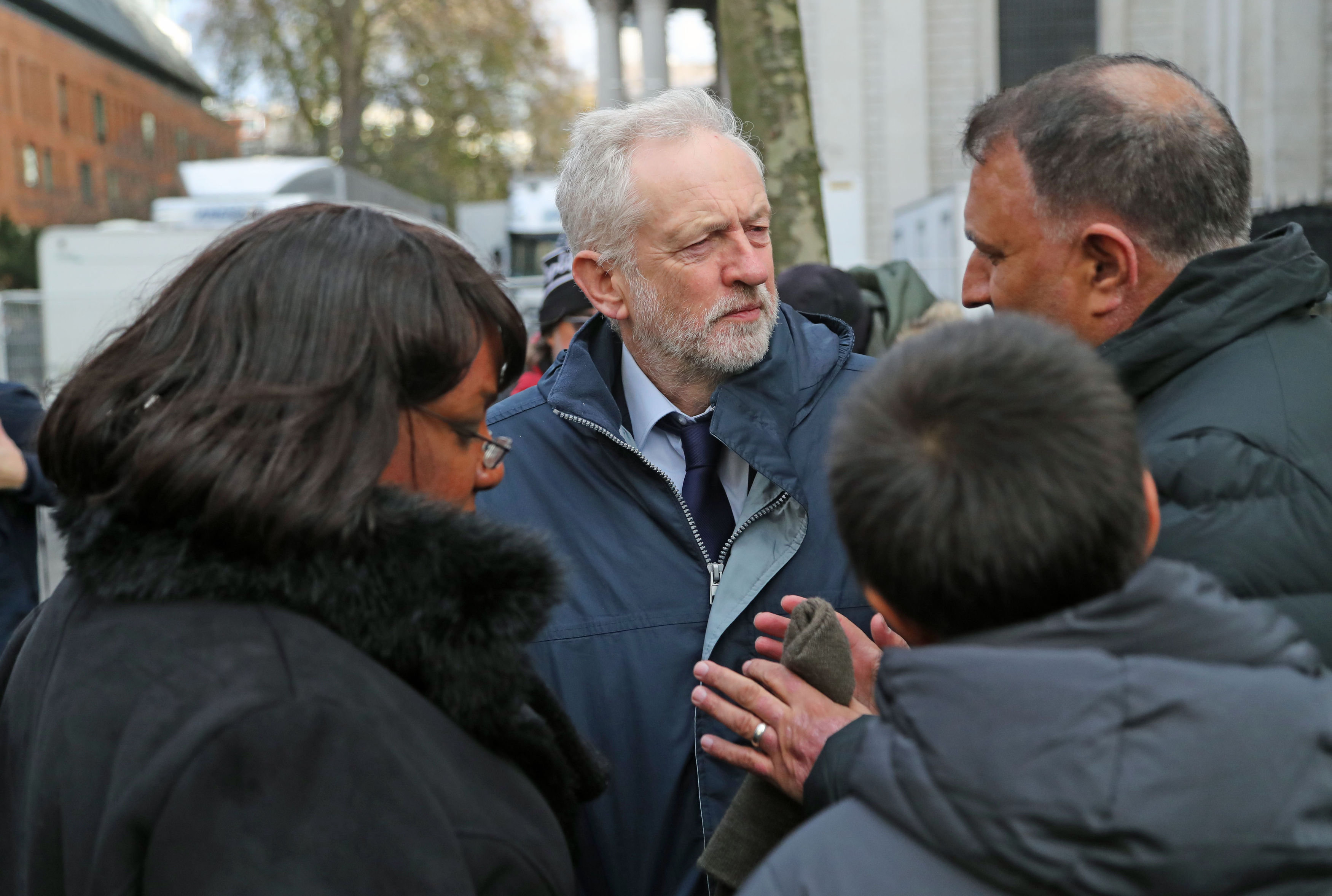 Labour Party leader Jeremy Corbyn and shadow home secretary Diane Abbott speak with people after theservice