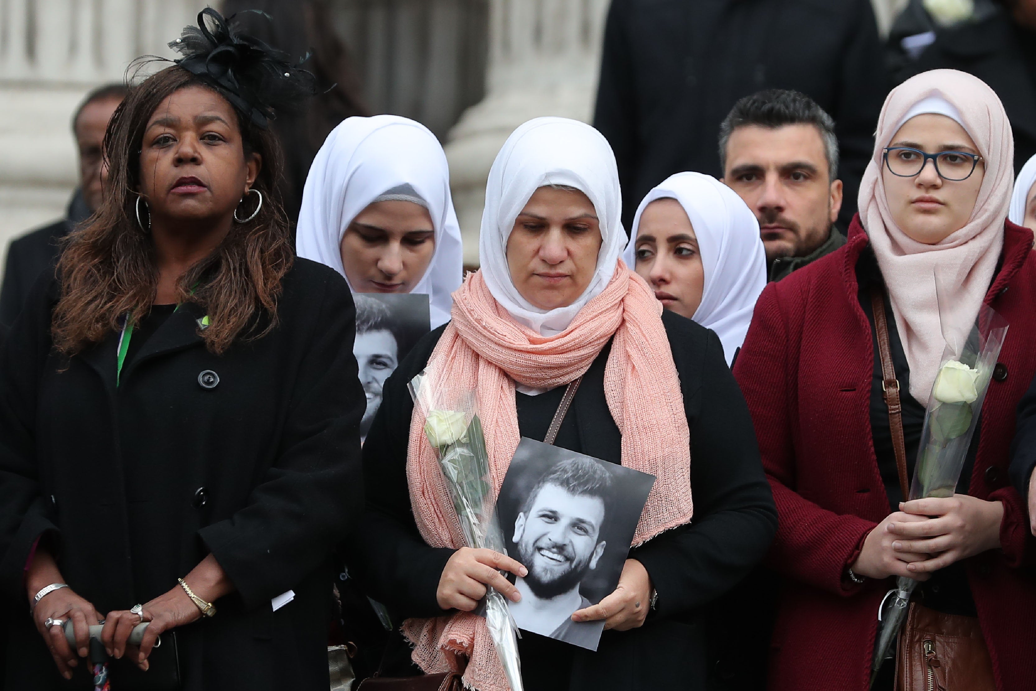 <strong>Clarrie Mendy (left) joins people leaving after the Grenfell Tower National Memorial Service</strong>