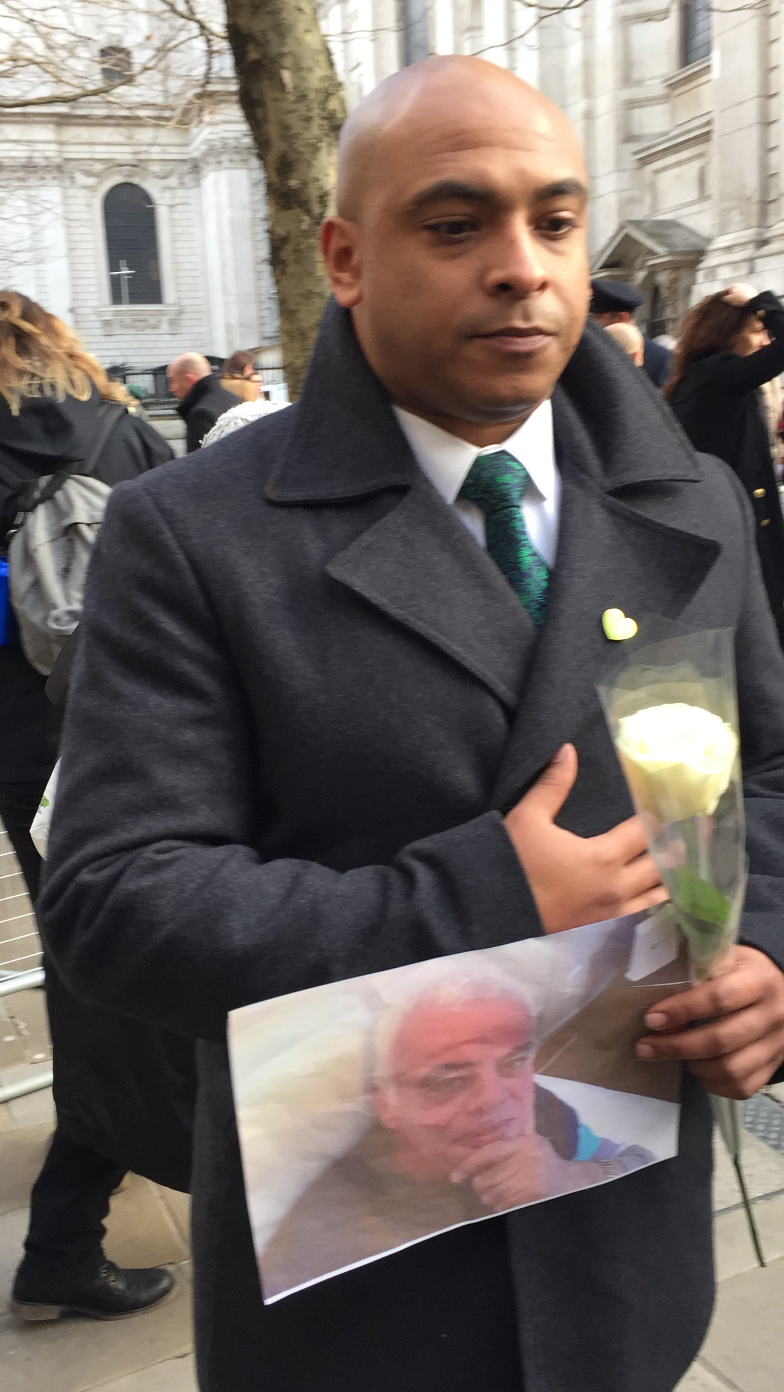 <strong>Karim Mussilhy holding a photo of his uncle Hesham Rahman, said 'it feels like it&rsquo;s been six hours' since the blaze, rather than six months.</strong>