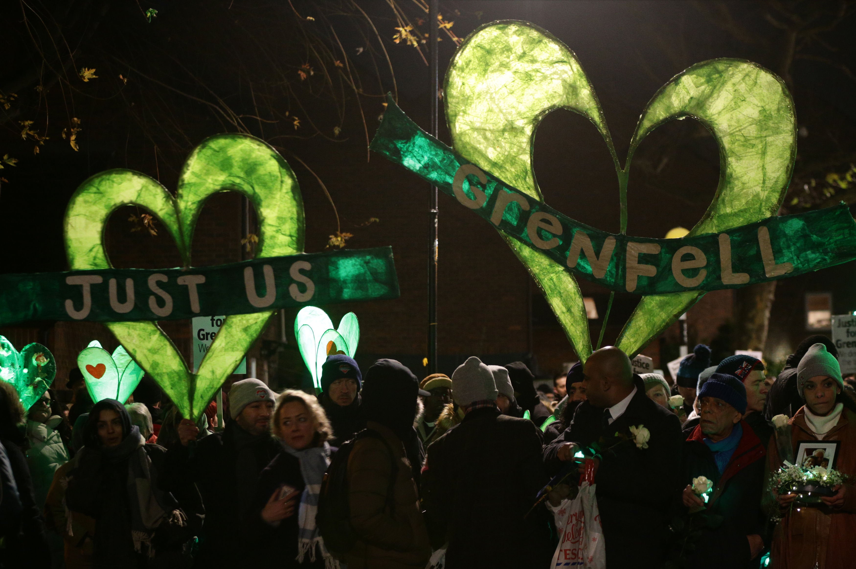 <strong>Many held homemade banners during the silent walk.</strong>