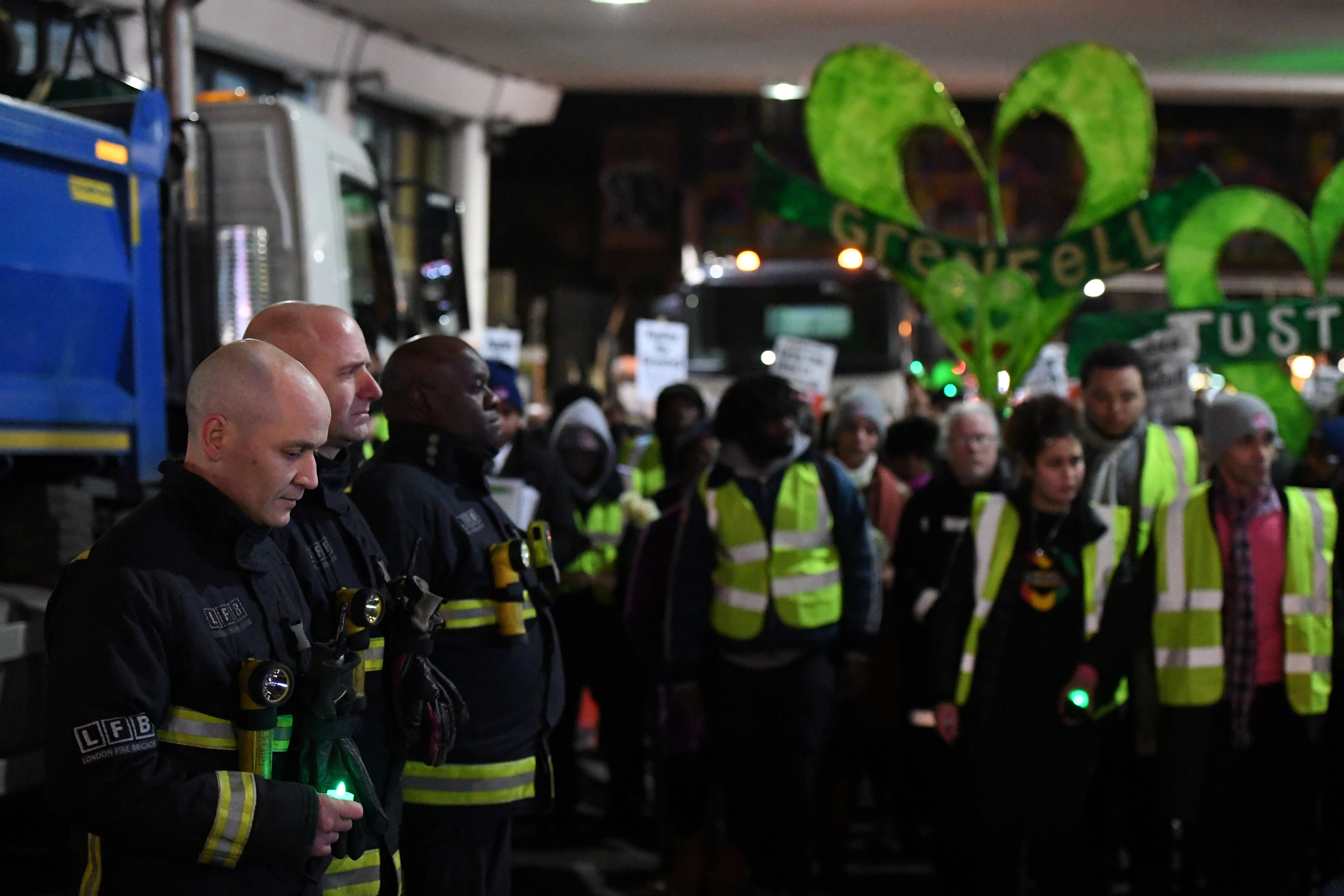 <strong>Members of the London Fire Brigade stand in a guard of hounour during a silent candlelit march to mark the six month anniversary of the Grenfell Tower fire.&nbsp;</strong>