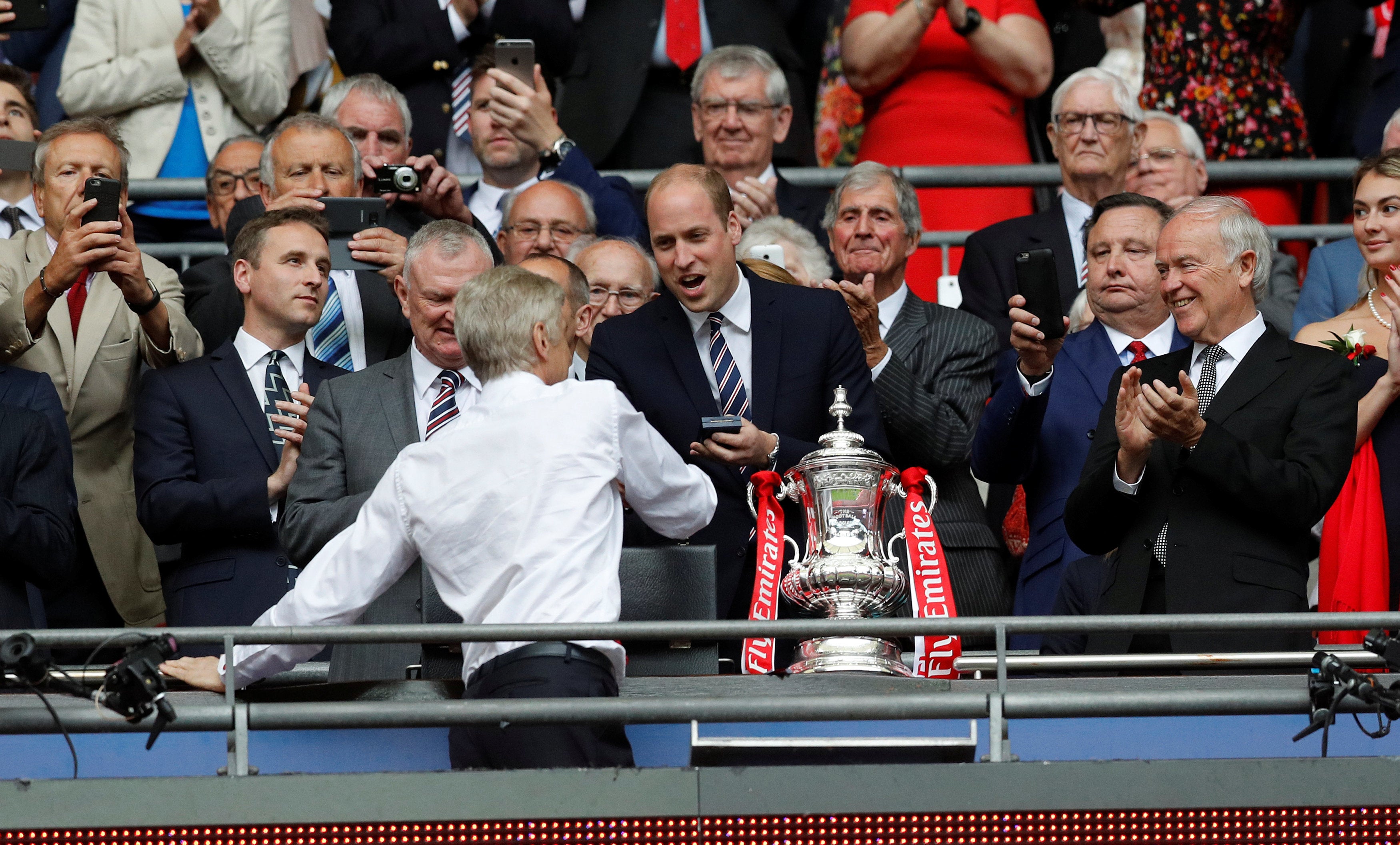 <strong>The Prince congratulates Arsenal Manager Arsene Wenger after his team won in May of this year.</strong>