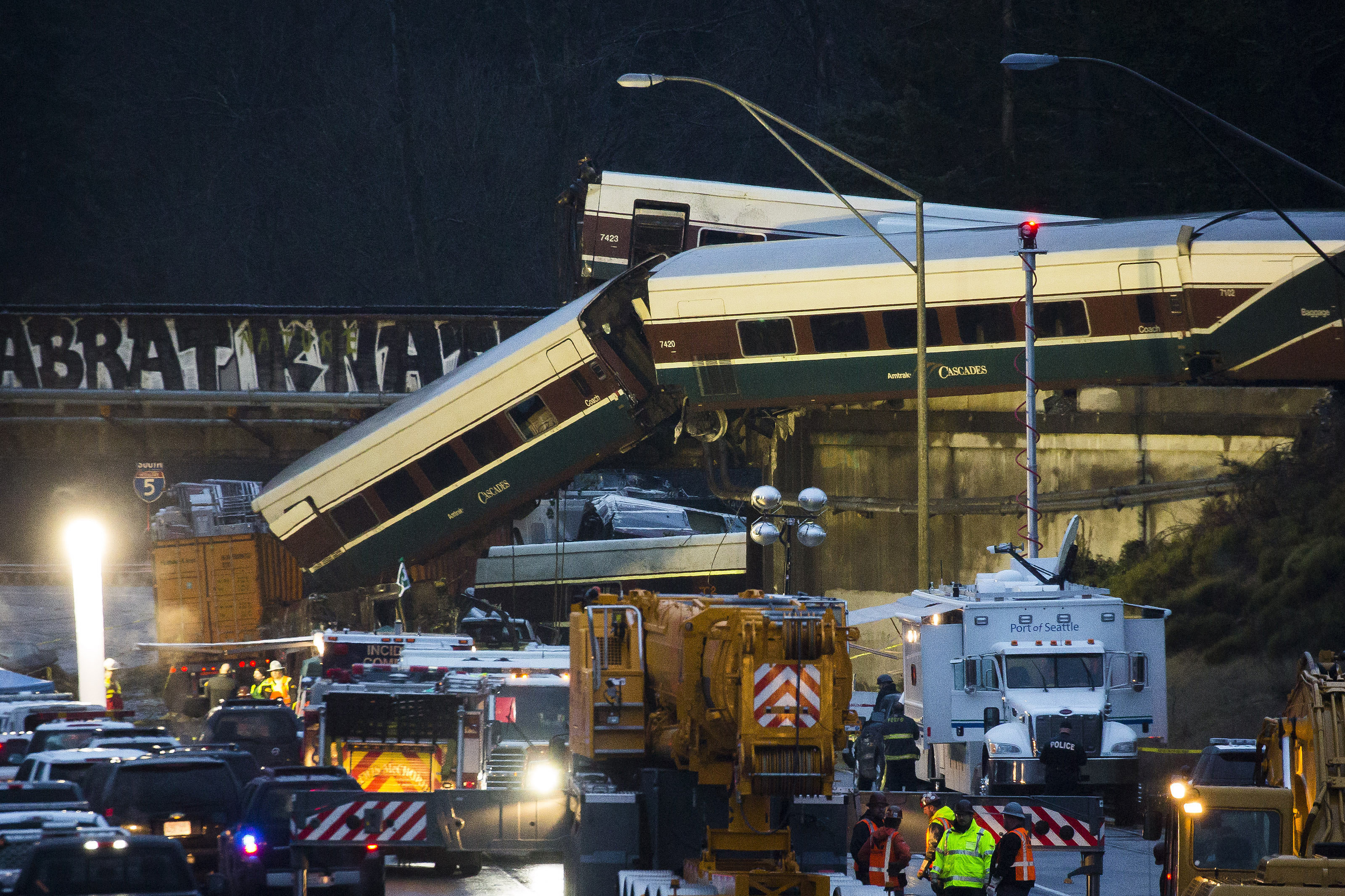 <strong>Amtrak train cars lie on Interstate 5 after a derailment in DuPont, Washington&nbsp;</strong>