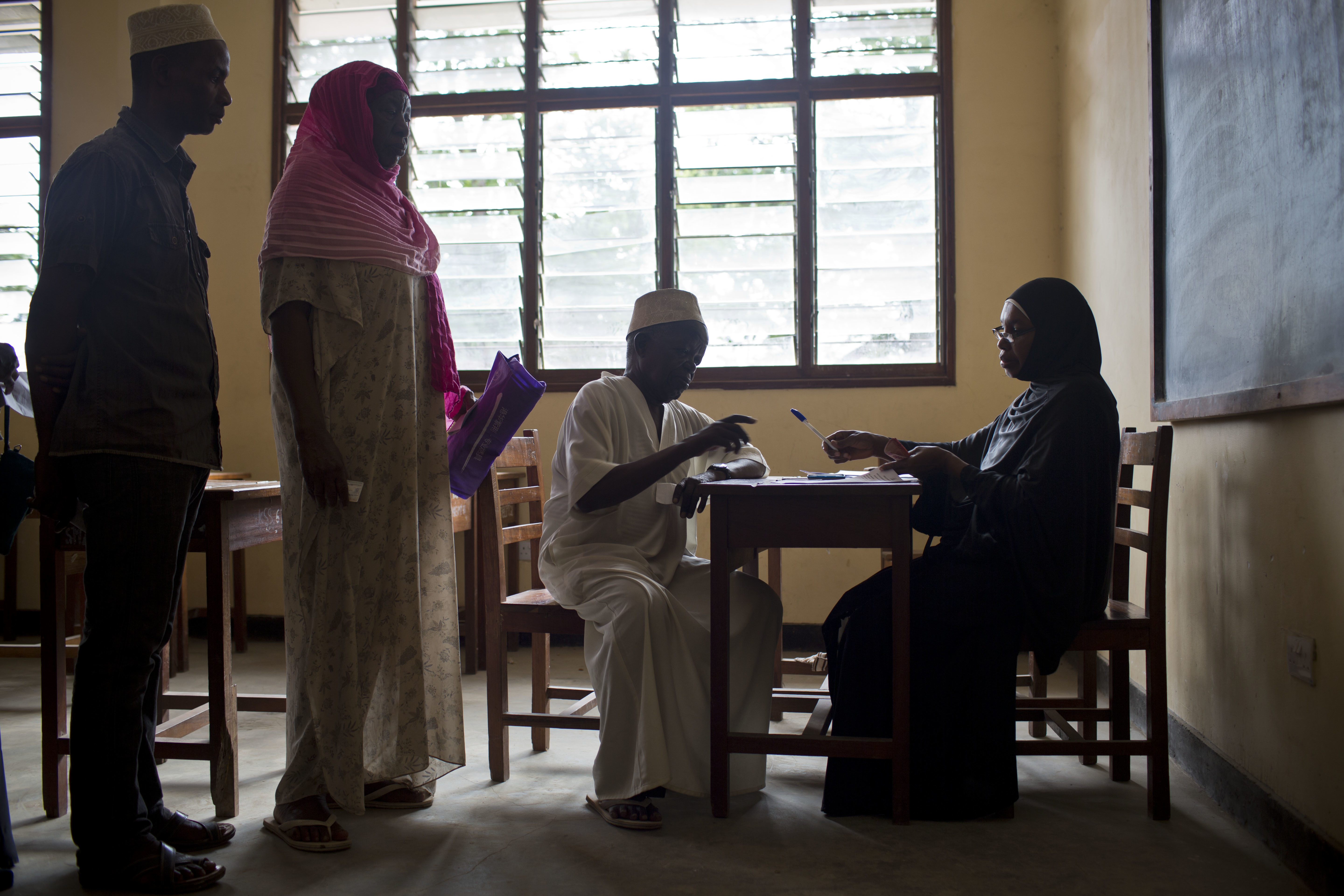 Older people collecting their pension in Zanzibar, where a universal social pension was introduced in 2016