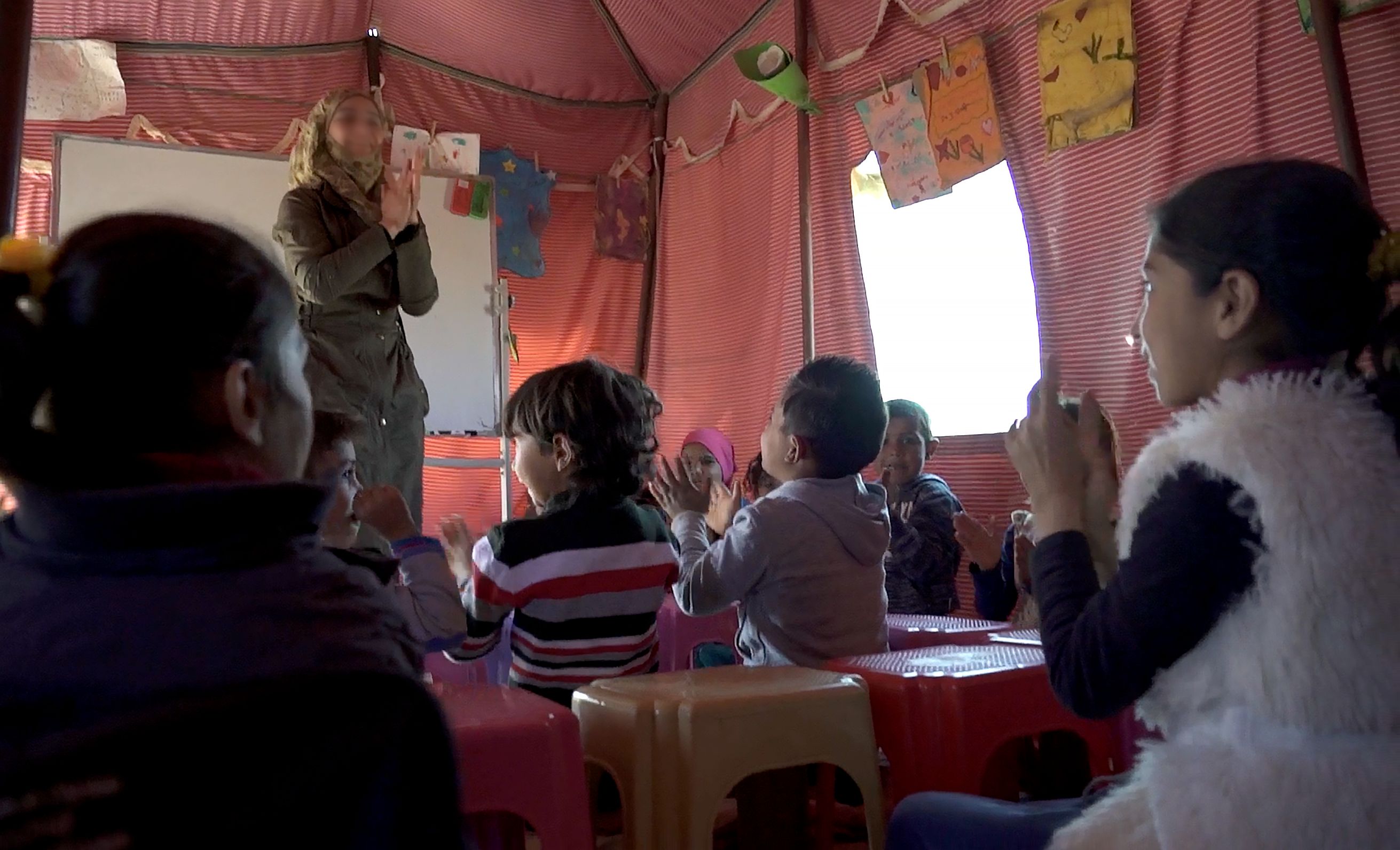 <strong>Syrian children at a makeshift school in Jordan</strong>