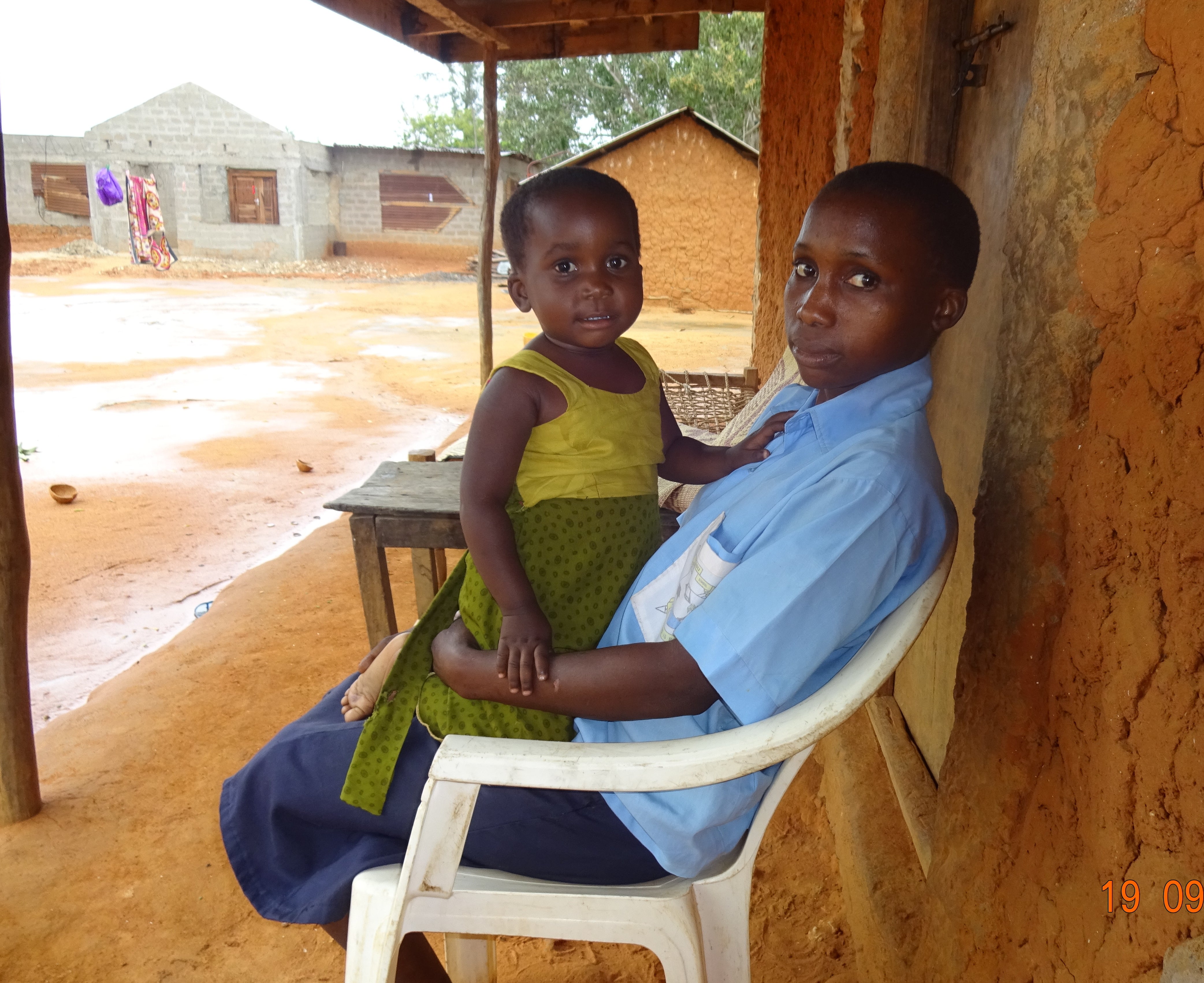 Dama's daughter models a dress her mother made for her