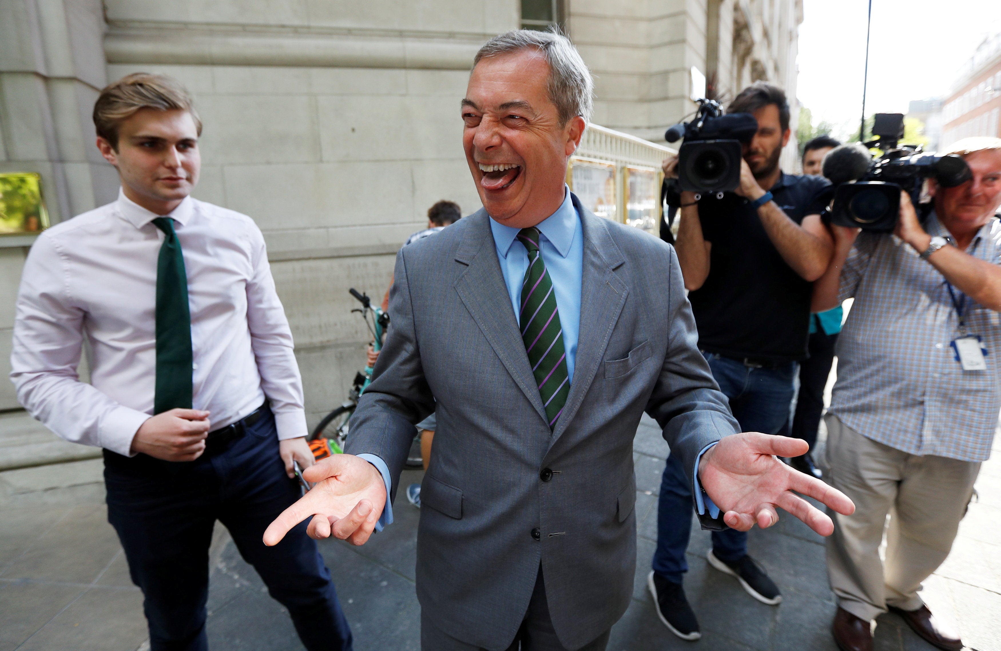 <strong>Nigel Farage, seen above earlier this year, has celebrated the return of the blue British passport</strong>