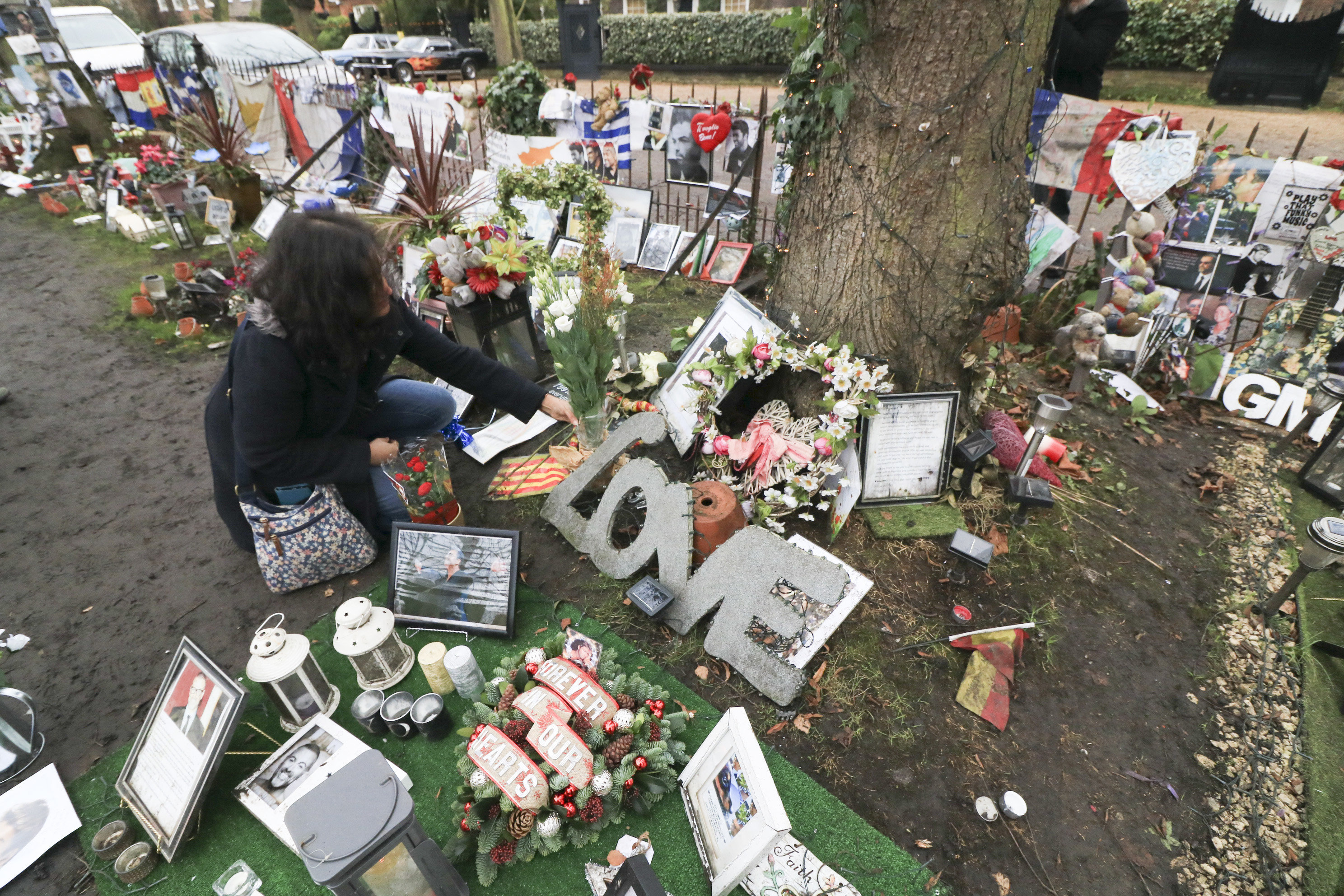 Fans have being paying tribute outside the singer's home one year after his death,