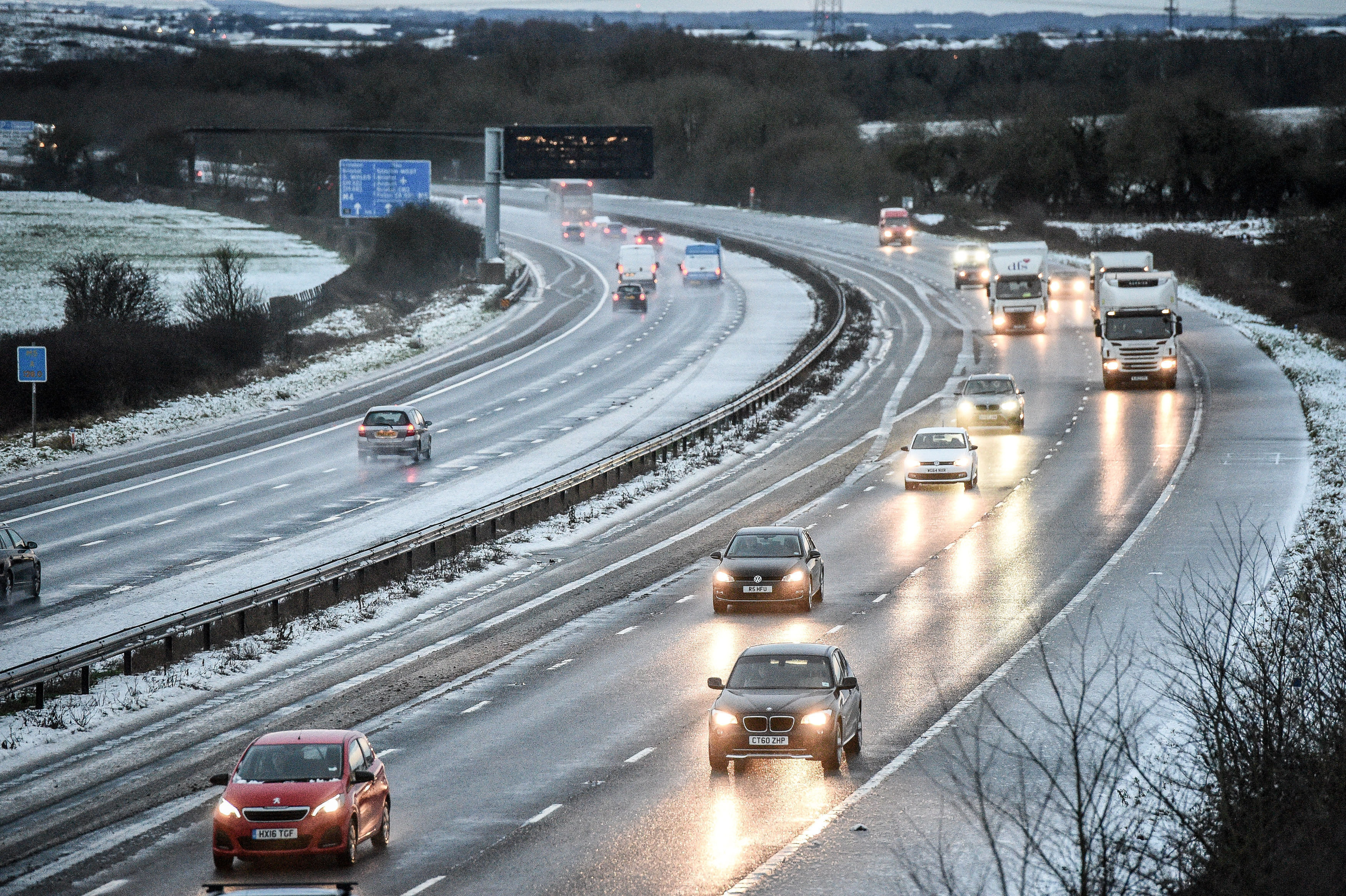 <strong>Snow reduces the M5 down to two lanes between Junction 14 an 15 in South Gloucestershire after overnight snow caused travel disruptions across parts of the UK.</strong>