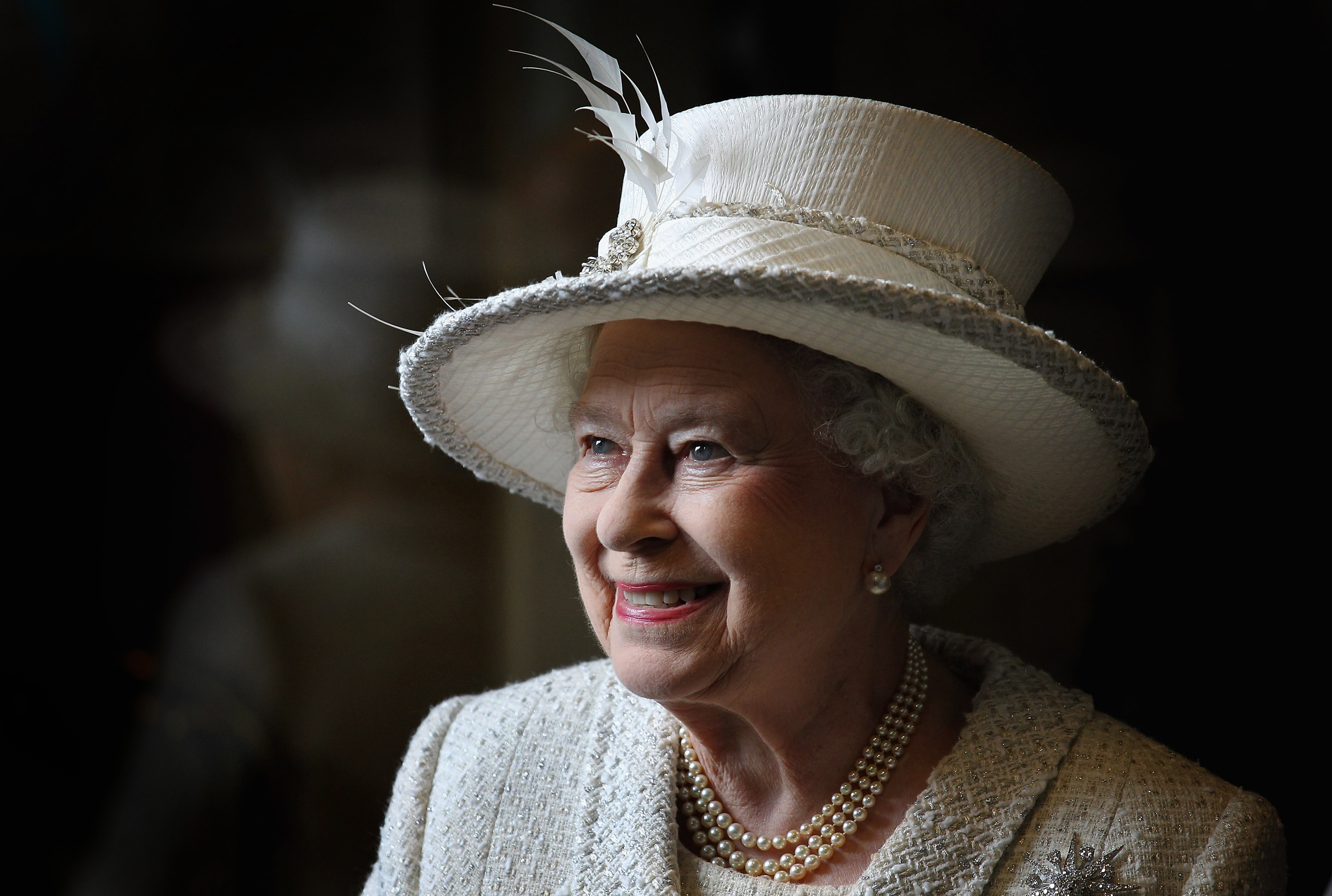 'Sometimes... The light just drops through the window... you get an image you're really happy with'.<br />The queen smiles as she visits Cyfarthfa High School and Castle in Merthyr, Wales.