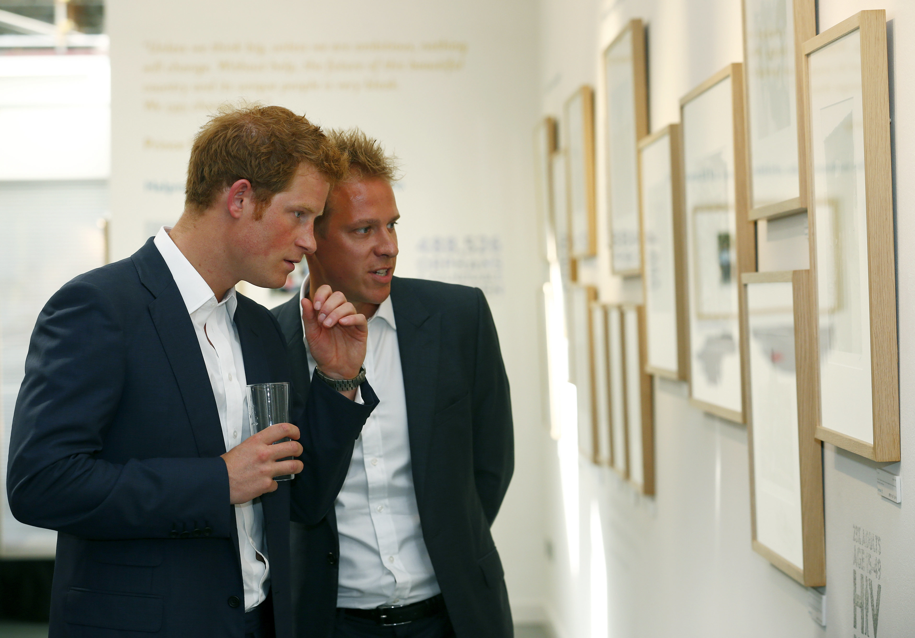 Prince Harry views Jackson's photographs of the Sentebale charity&nbsp;