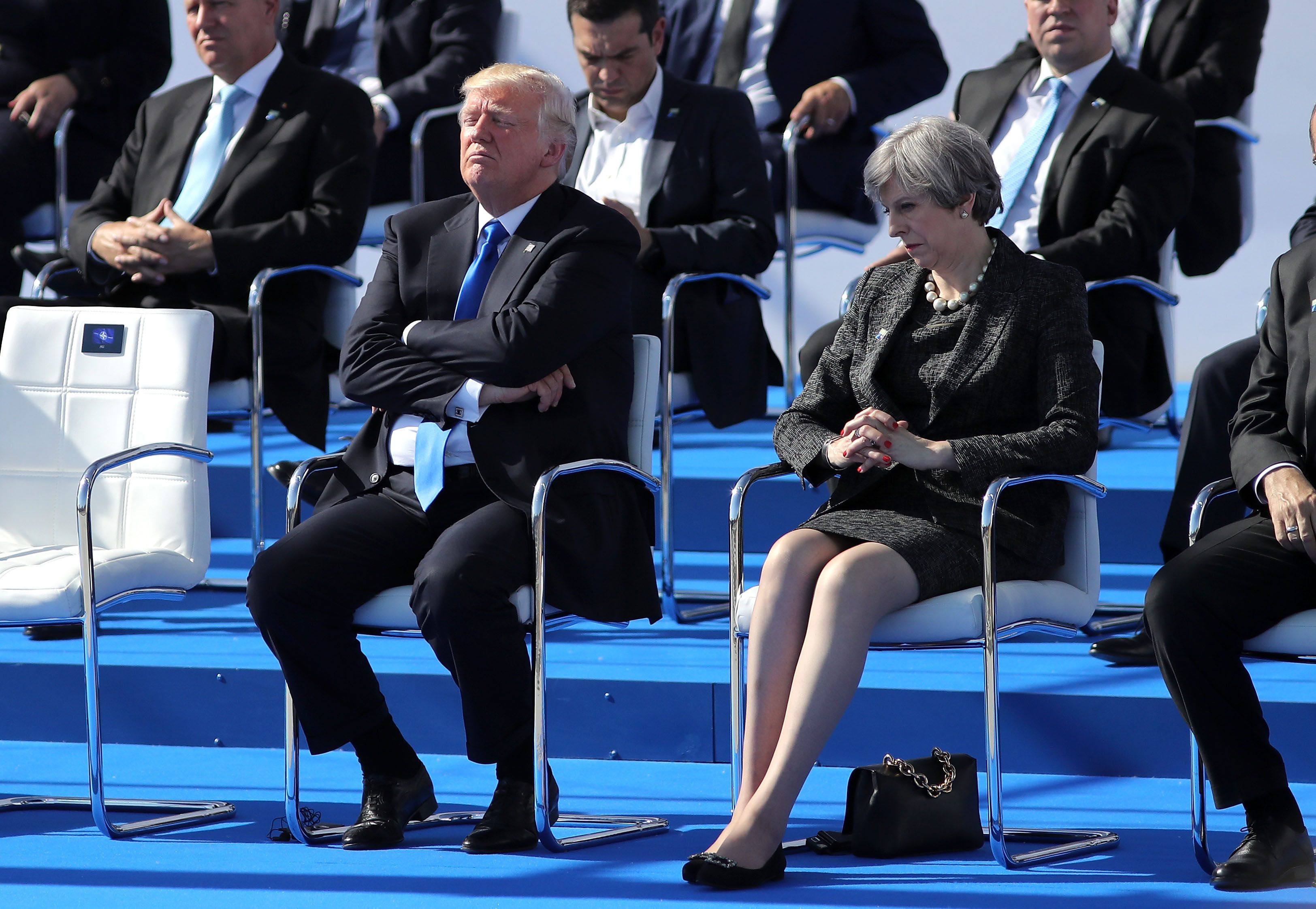 <strong>Four months after the hand holding, May and Trump met at the Nato summit in Brussels and looked less happy to see each other</strong>