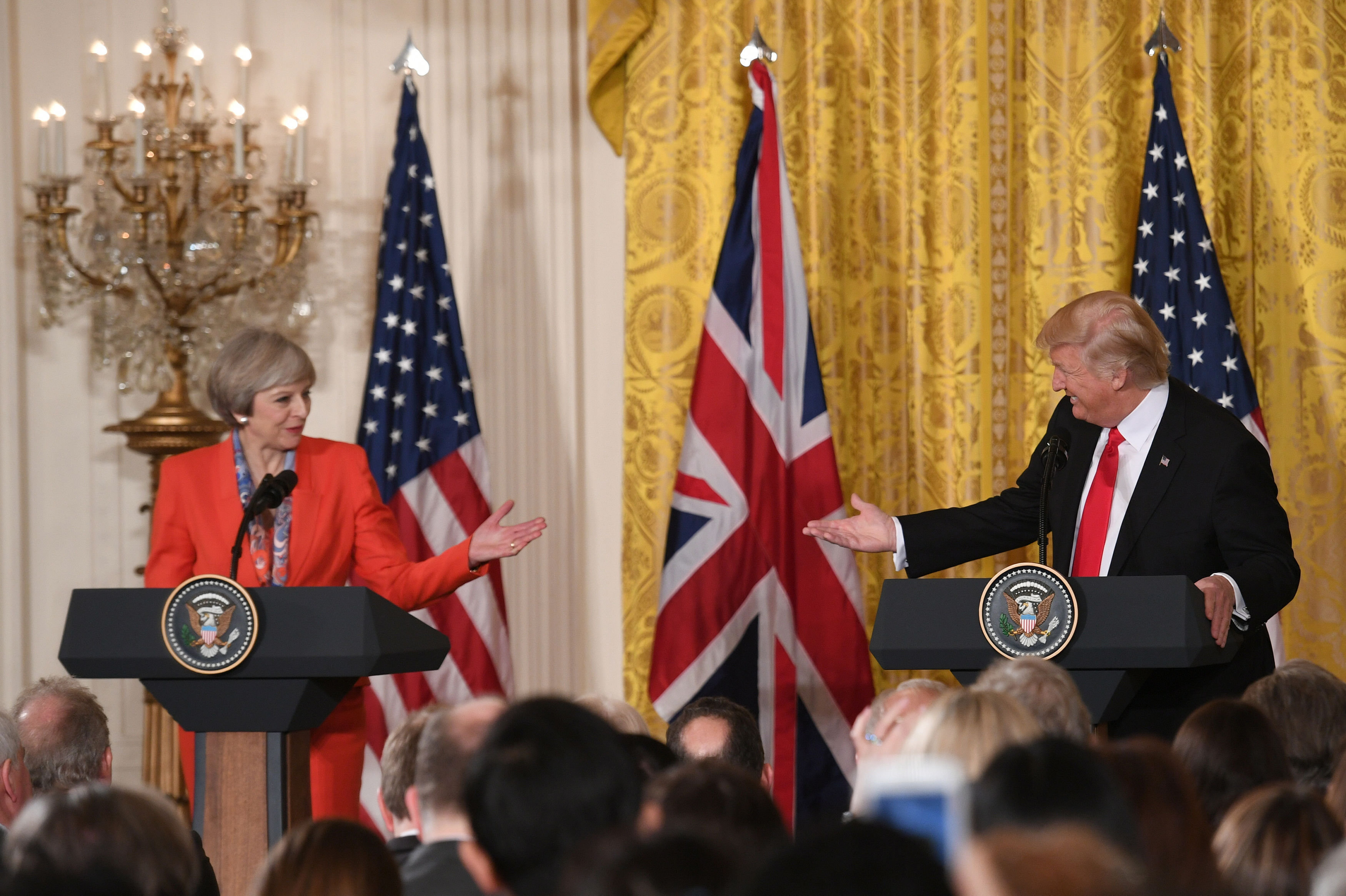 <strong>All smiles: Trump and May at their January meeting. He signed the travel ban order just after she left Washington,&nbsp;shocking British politicians</strong>