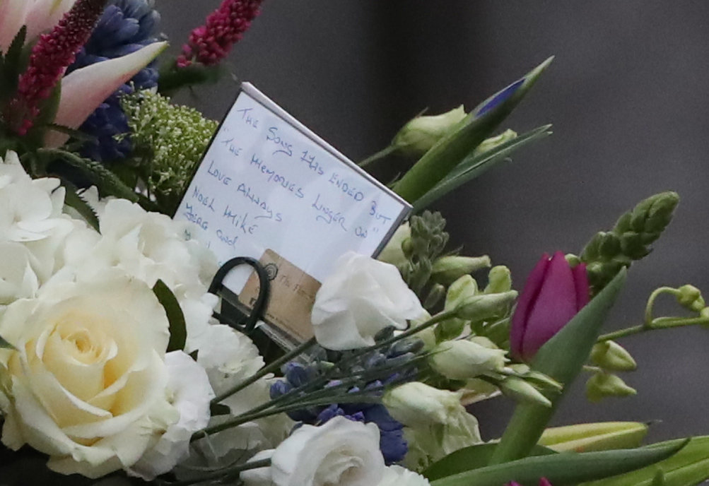 <strong>A floral tribute from bandmates is placed on the coffin of Cranberries singer Dolores O'Riordan as it leaves St Joseph's Church in Limerick.</strong>