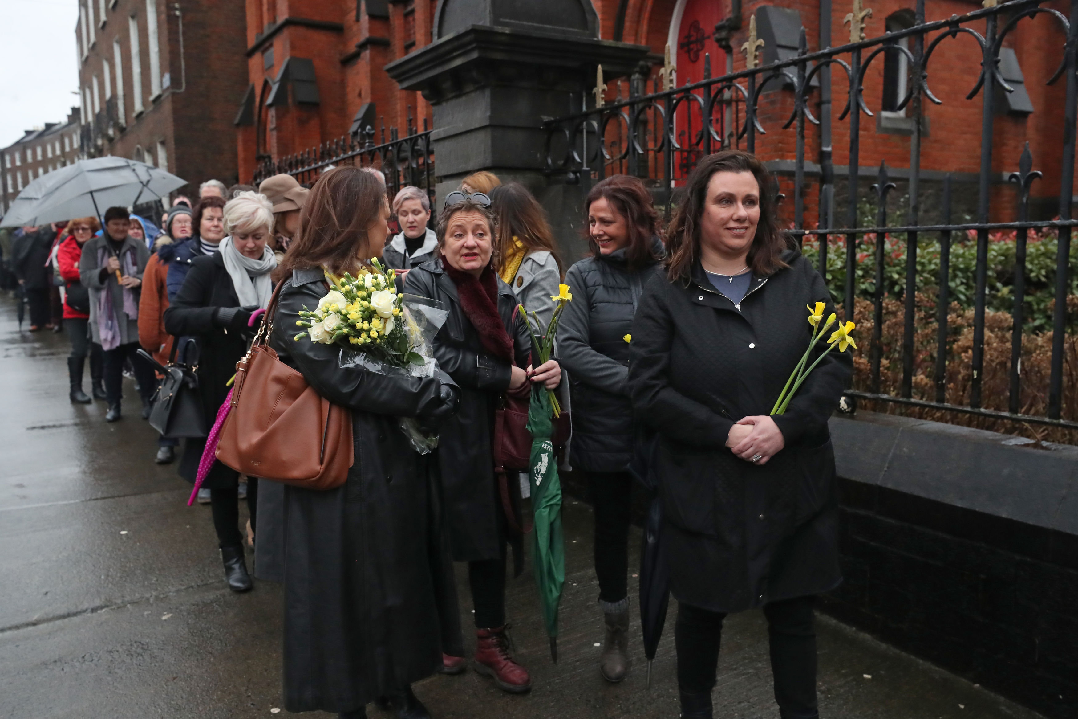 <strong>People queue to pay their respects to Cranberries singer Dolores O'Riordan at St Joseph's Church in Limerick, Ireland, during a public reposal.</strong>