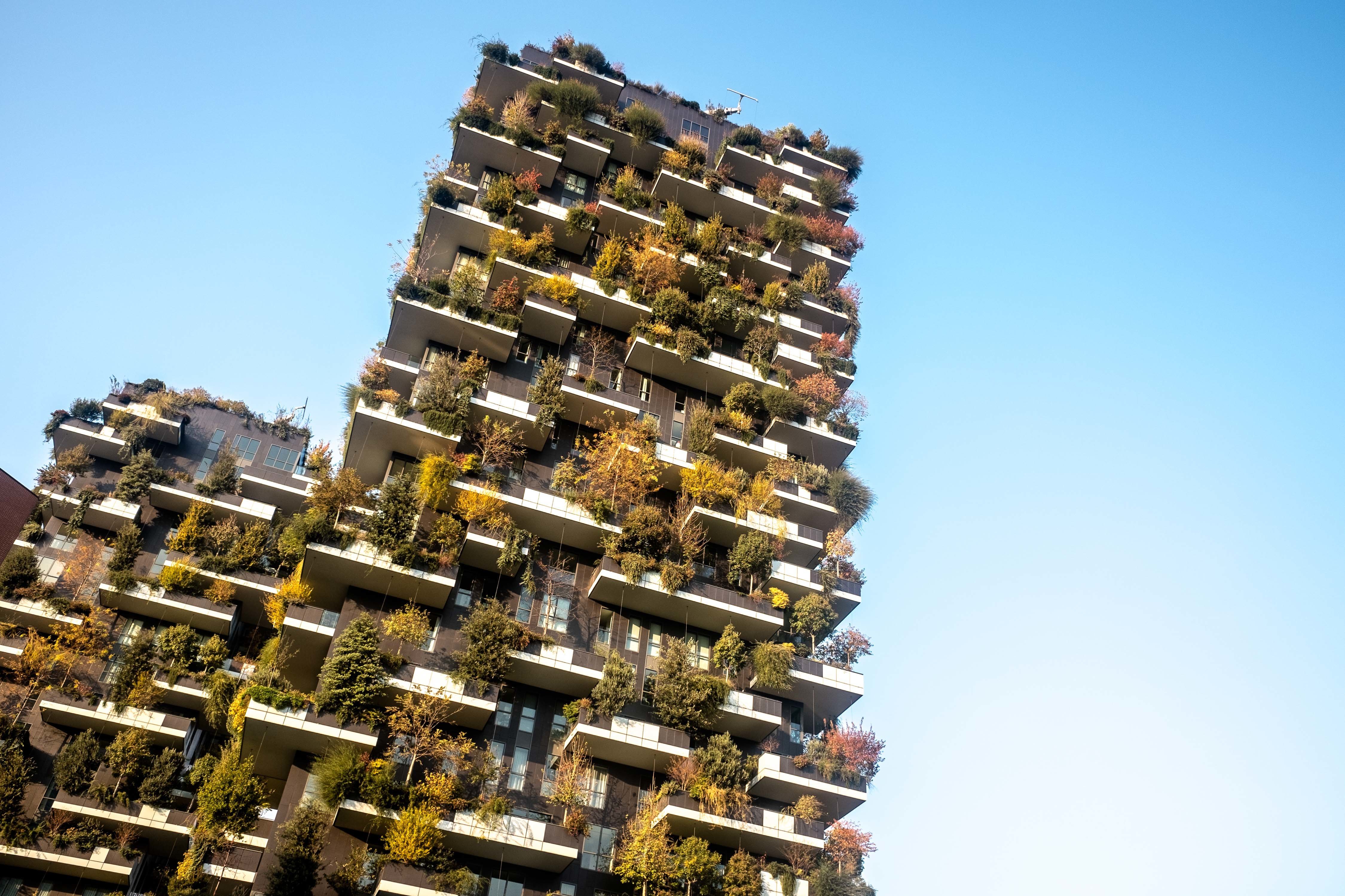 The Bosco Verticale buildings in autumn in Porta Nuova complex. The complex is an 11-story office building. Its height is 111 meters and 76 meters that will gather more than 900 trees of 96,000 sq ft. terraces.