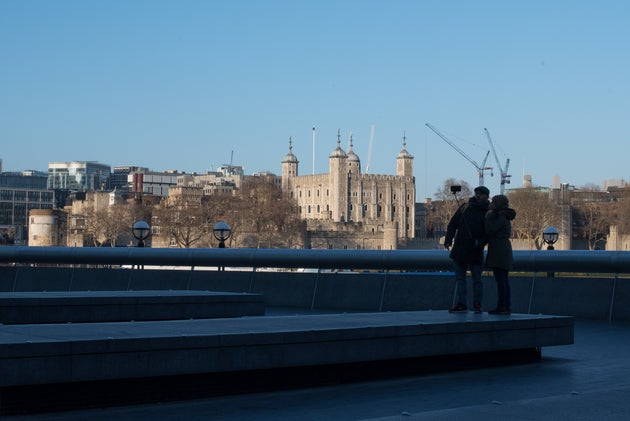 Temperatures are expected to be in the double-digits for most parts of the UK today and Friday; a couple is seen above taking a selfie near the Tower of London earlier this month