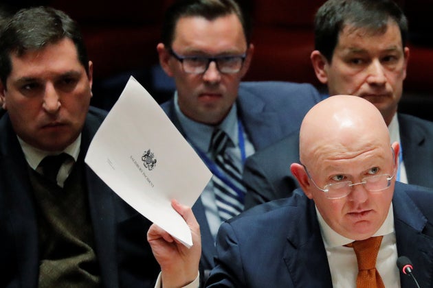 Russian Ambassador to the United Nations, Vasily Nebenzya, holds a copy of a British report on an incident in Salisbury.