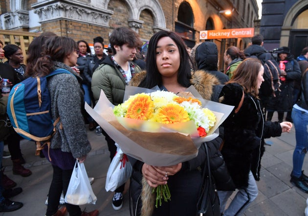 Members of the public take part in an anti-gun and knife rally at Hackney Central Station near where Israel Ogunsola was killed on Wednesday