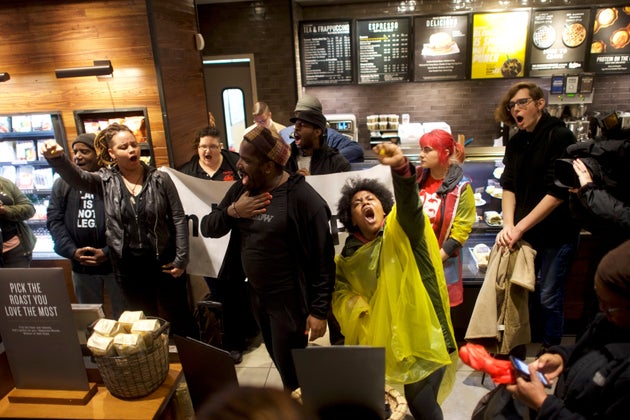 Demonstrators inside a Starbucks in Philadelphia on Monday, protesting after two black men were arrested in the store last week.