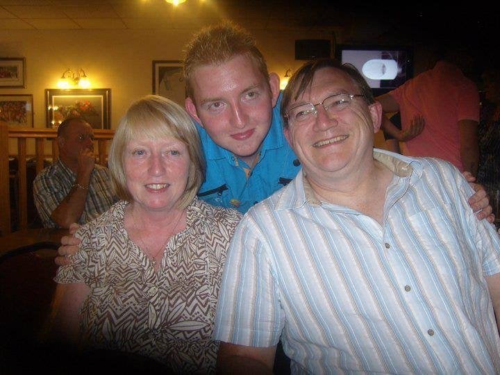 Adam Bradford and his parents.