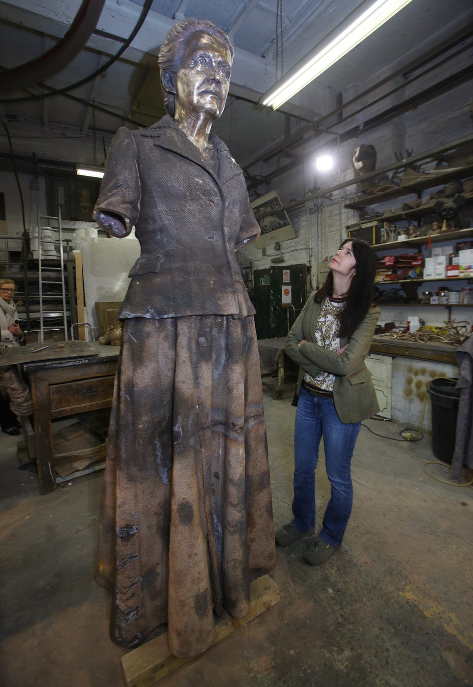 Artist Gillian Wearing watches the finishing touches being added to the statue of suffragist leader Millicent Fawcett.