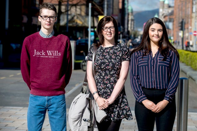 Siobhan McLaughlin (centre) and her children Billy and Rebecca Adams, as the trio arrive at the Royal Courts of Justice in Belfast.