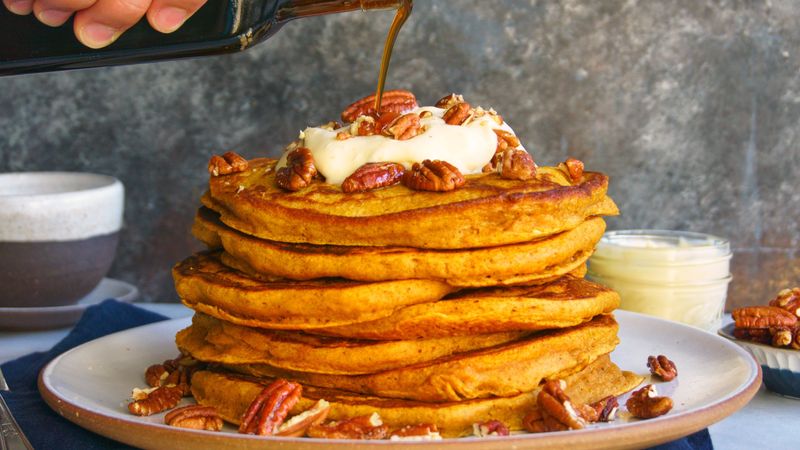 pumpkin spice pancakes with candied pecans and orange creme