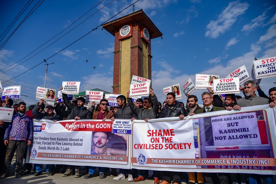 Kashmiri traders are seen holding banners and placards during a protest against attacks on Kashmiri Muslims outside valley in Srinagar.