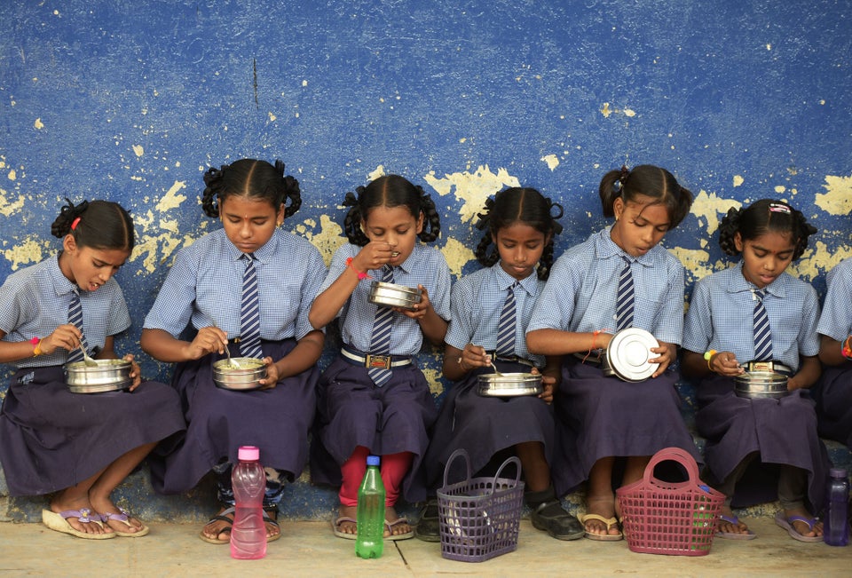 A file photograph of children eating their mid-day meal.
