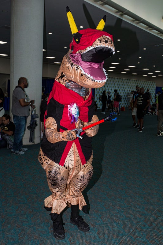 A cosplayer dressed as Tyrannosauras Deadpool.